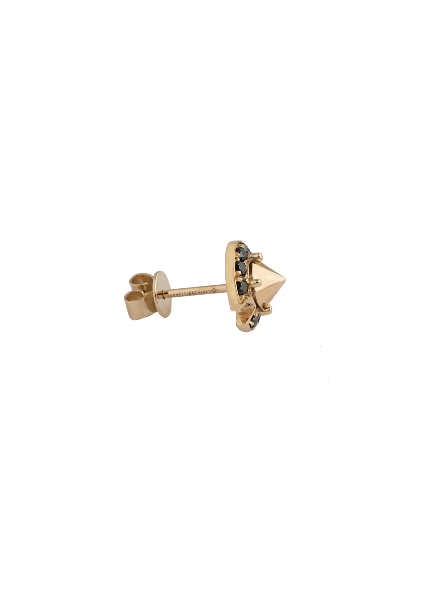 Surrounded by a black diamond round pavé to define the centeral stud, this single pierced earring walks the balance of edge and elegance. 
Crafted in 10carat yellow gold,  the earring is offered in a single style that can be worn alone and mixed