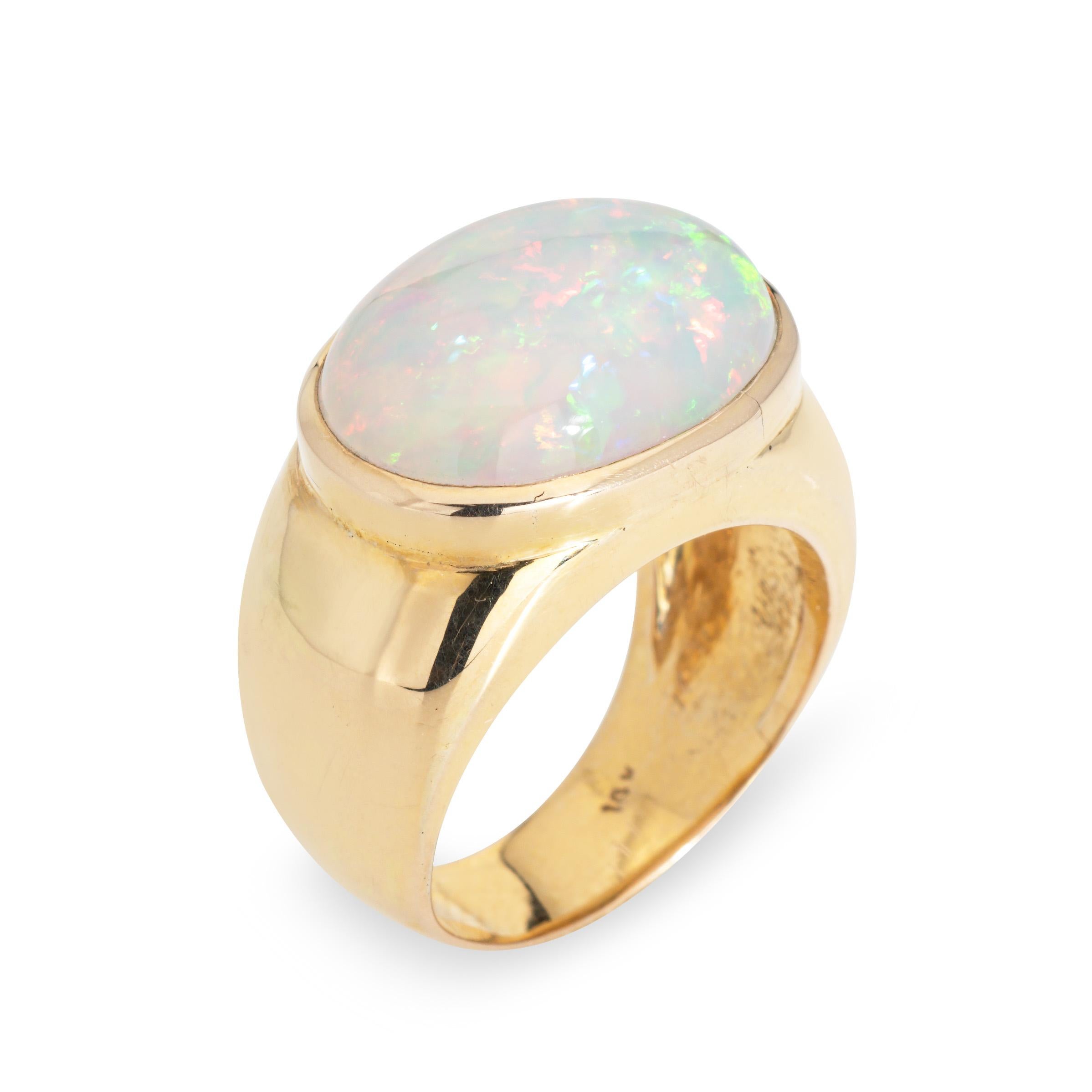 Stylish natural Ethiopian opal & diamond ring crafted in 14k yellow gold. 

Bezel set natural opal measures 19mm x 14mm (estimated at 10 carats). The opal is a later addition to the ring and is in very good condition (free of cracks or chips). 

The