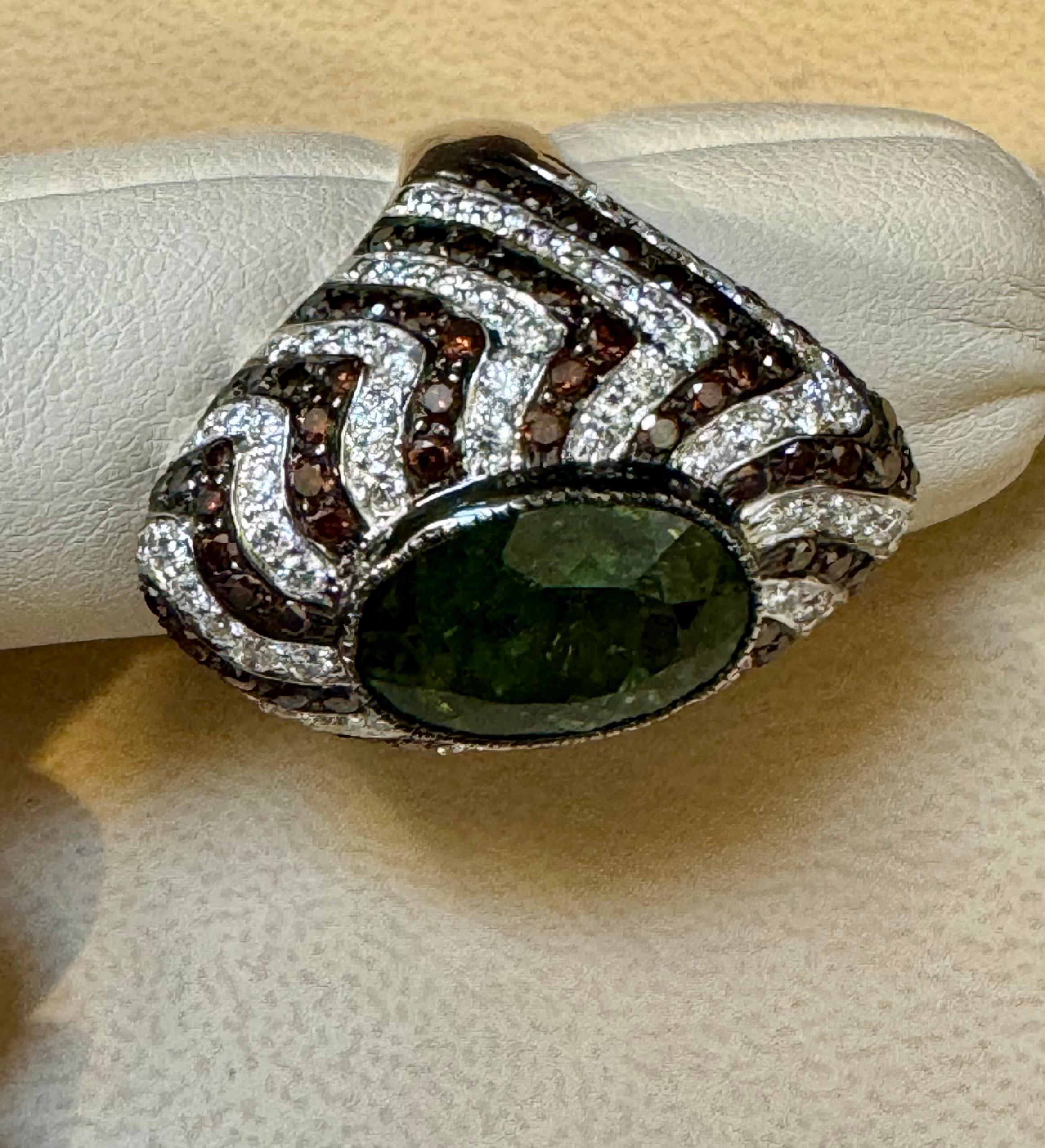 10 Ct Green Tourmaline & 4.2 Ct Diamond Zigzag Cocktail Ring 18 Kt White Gold Size  6.5
This spectacular Cocktail ring   consisting of a single Oval  Shape Green Tourmaline  approximately 10  Carat.  The  Green Tourmaline  is surrounded by