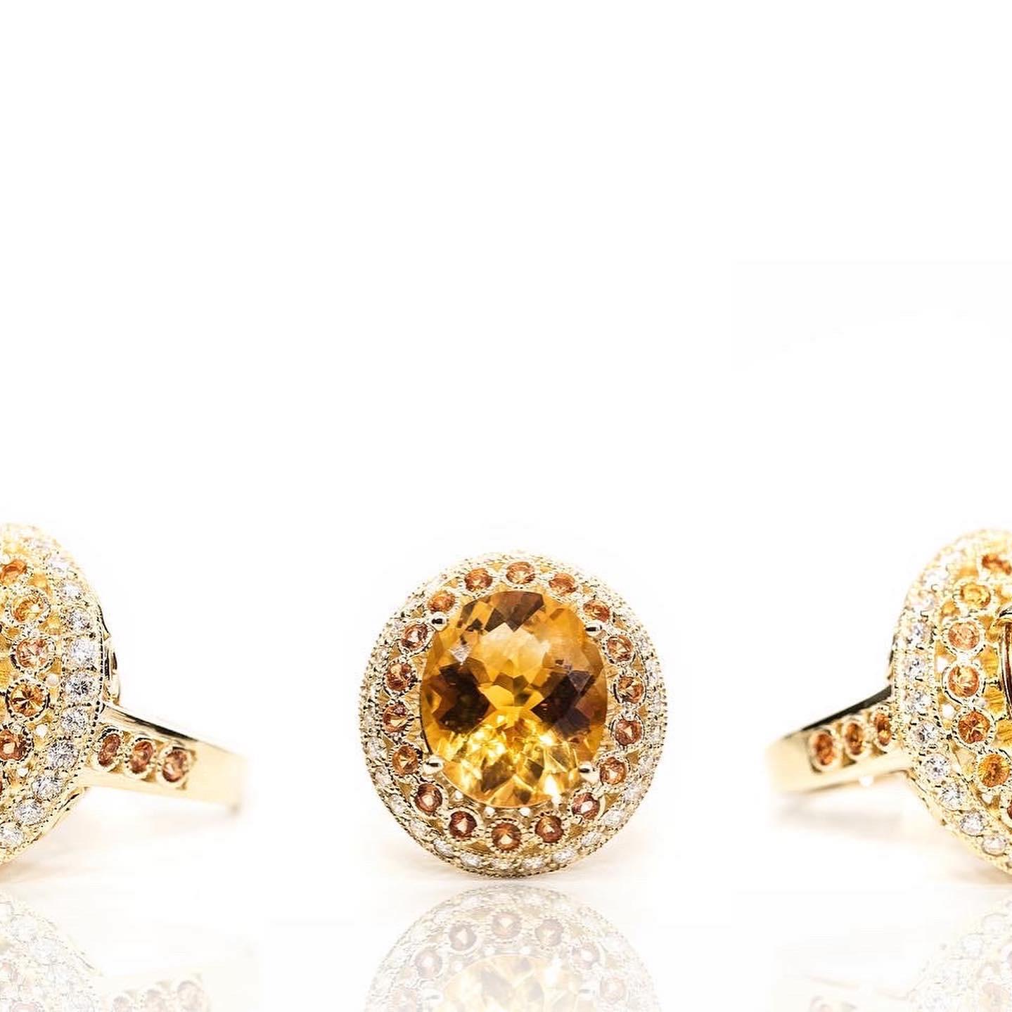 Huge 10ct natural Orange Citrine is set in 14k yellow gold with diamonds and sapphires. Price Drop so final sale. 

A stunning piece of glamour. It is the perfect statement ring that says tasteful and sophisticated. The centre stone is a AAA 10ct