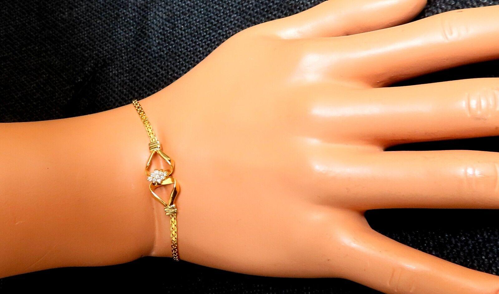 Ladies natural Diamond knot link bracelet.

.10ct Diamonds: J- color, I2 clarity.

14 karat yellow gold 3.6 grams

Bracelet measures 6.5mm wide

Comfortable pressure clasp and safety snap.