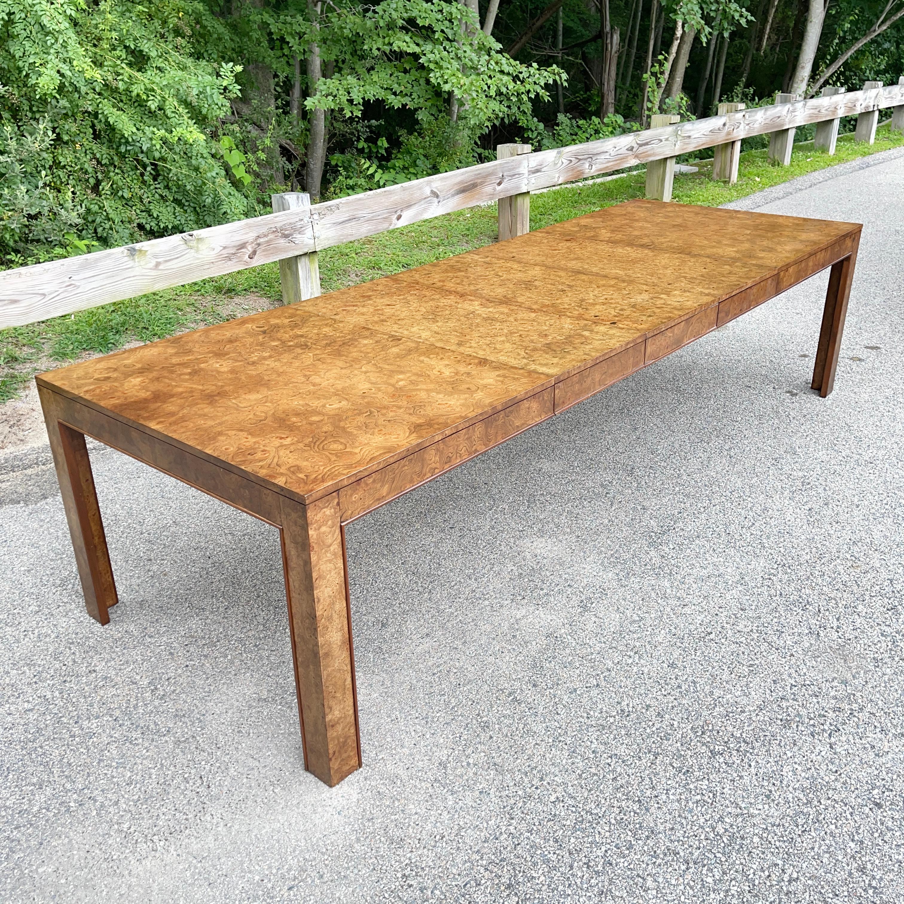 1970's expandable parsons form dining table from John Widdicomb/John Stuart in highly figural olive ash burl. Restored by our expert refinisher.
Dimensions: 30 in high x 42 in wide x 68 in long when closed.
Expandable up to 122 in long with all
