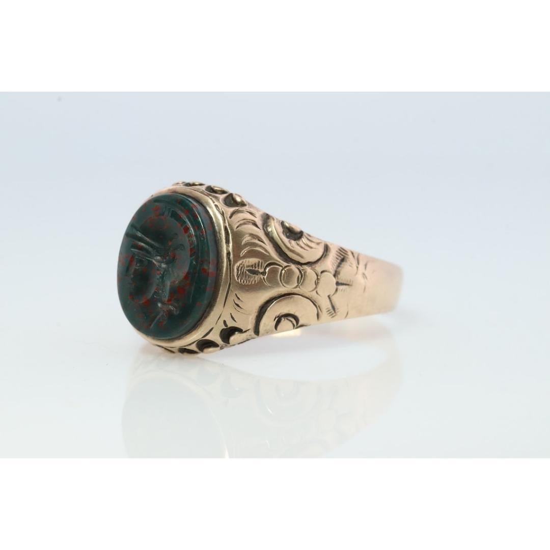 Vintage from the 1960s
Size: 9 US
Materials: Gold
Gemstone: Bloodstone
Gem color: Black

Band color: Gold

About this item

This is a super unique ring. Bloodstone signet ring.

Carved Warrior Intaglio

Condition: Shows minimal signs of wear. Has