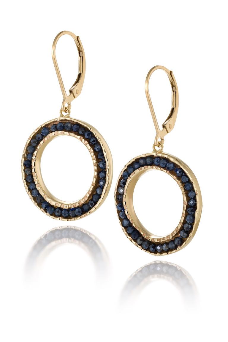 10K yellow gold dangle Coin earrings with Sapphires are part of the Coin collection of earrings, cuffs, and rings.  These elegantally casual earrings pair well with any outfit or any occasion.
The leaver backs are solid 14K gold. 