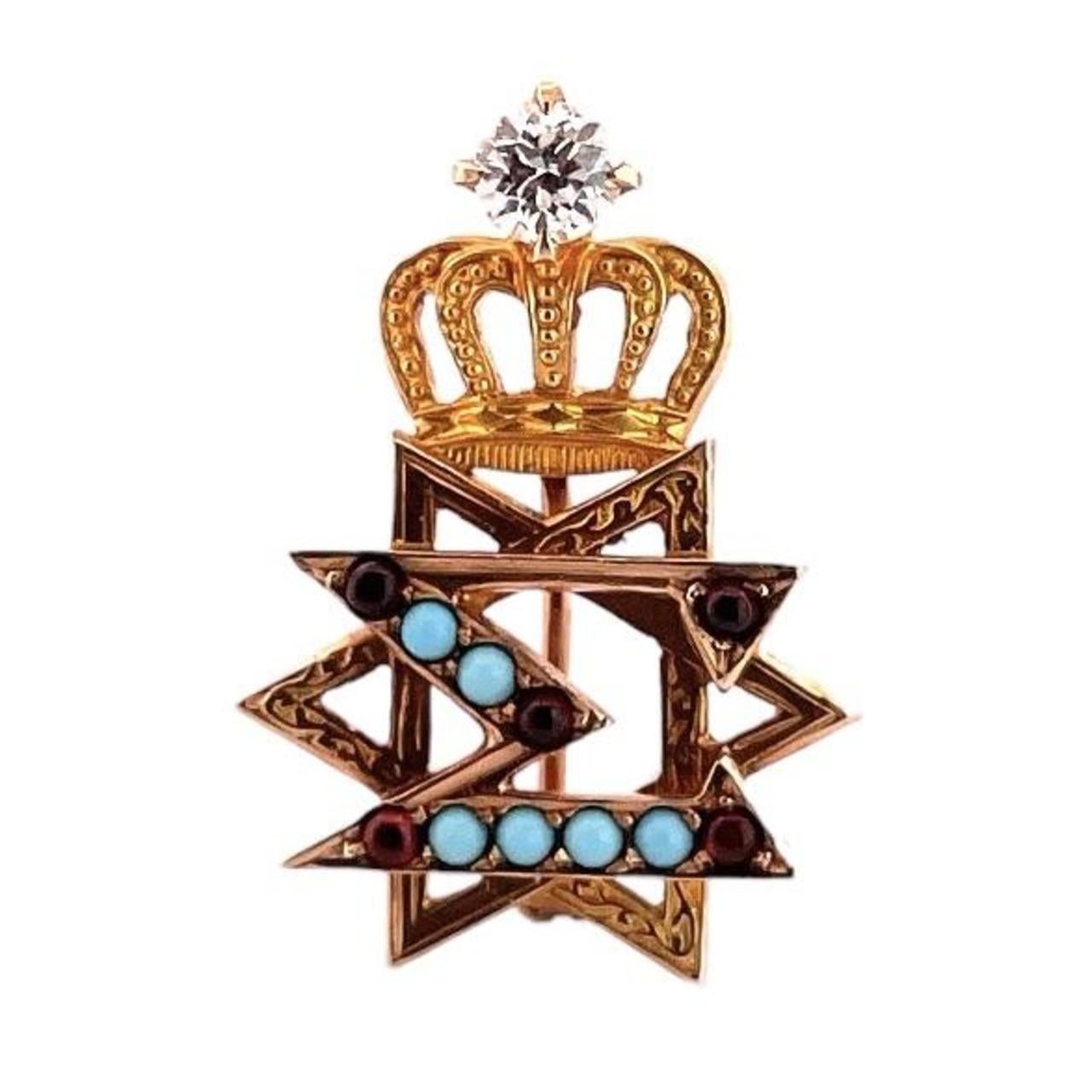 10K Yellow Gold Turquoise and Garnet Star of David Fraternity Pin is a symbolic piece of jewelry that beautifully combines religious significance with timeless elegance.
Crafted from high-quality 10-karat gold
The pin takes the form of the Star of
