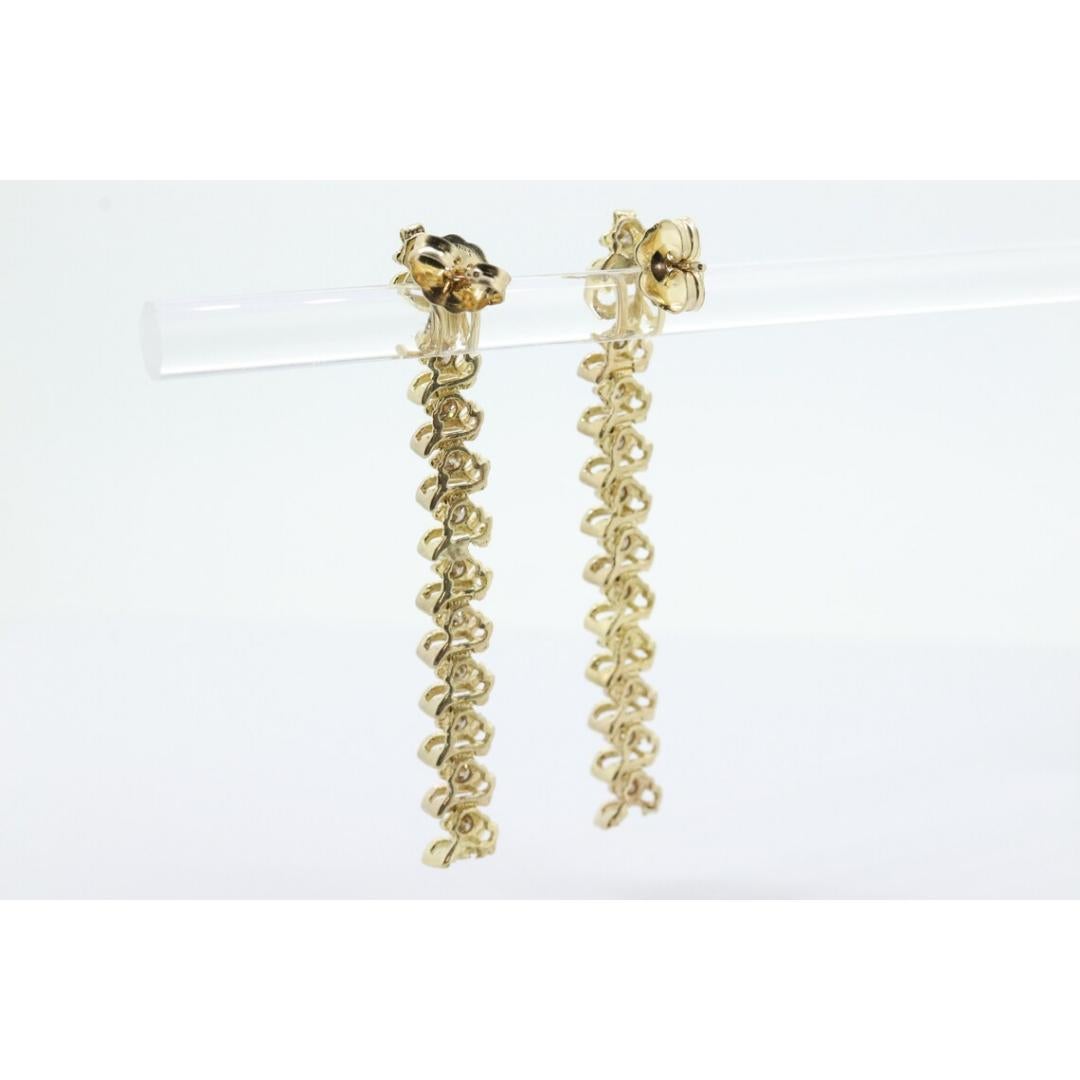 Vintage des années 1990
MATERIAL : Pierre
Pierre précieuse : Diamant
Emplacement : Lobe d'oreille
Fermeture : Fermeture à vis

Style : Minimaliste

Merveilleuses boucles d'oreilles 10k.

Boucles d'oreilles en ligne diamantée segmentée Tennis