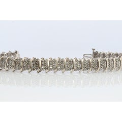 10k Diamond Tennis Bracelet. 10k S-LINK round diamond cluster Tennis bracelet.