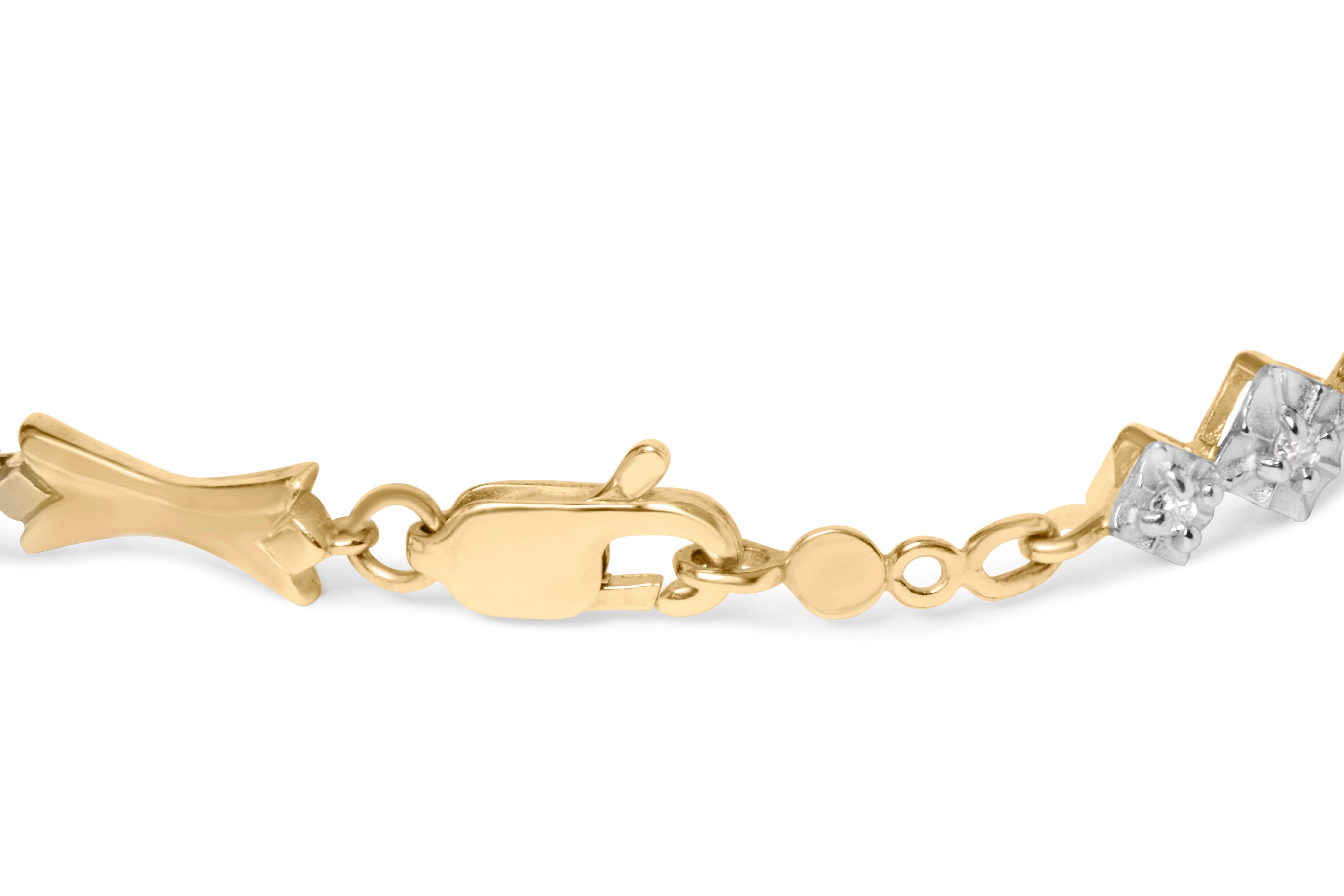 Entrez dans un monde d'élégance divine avec cet exquis bracelet en or bicolore orné de diamants. Réalisée en or 10 carats, cette pièce rayonne d'une allure captivante qui enchantera toutes les femmes. Le bracelet présente un superbe arrangement de