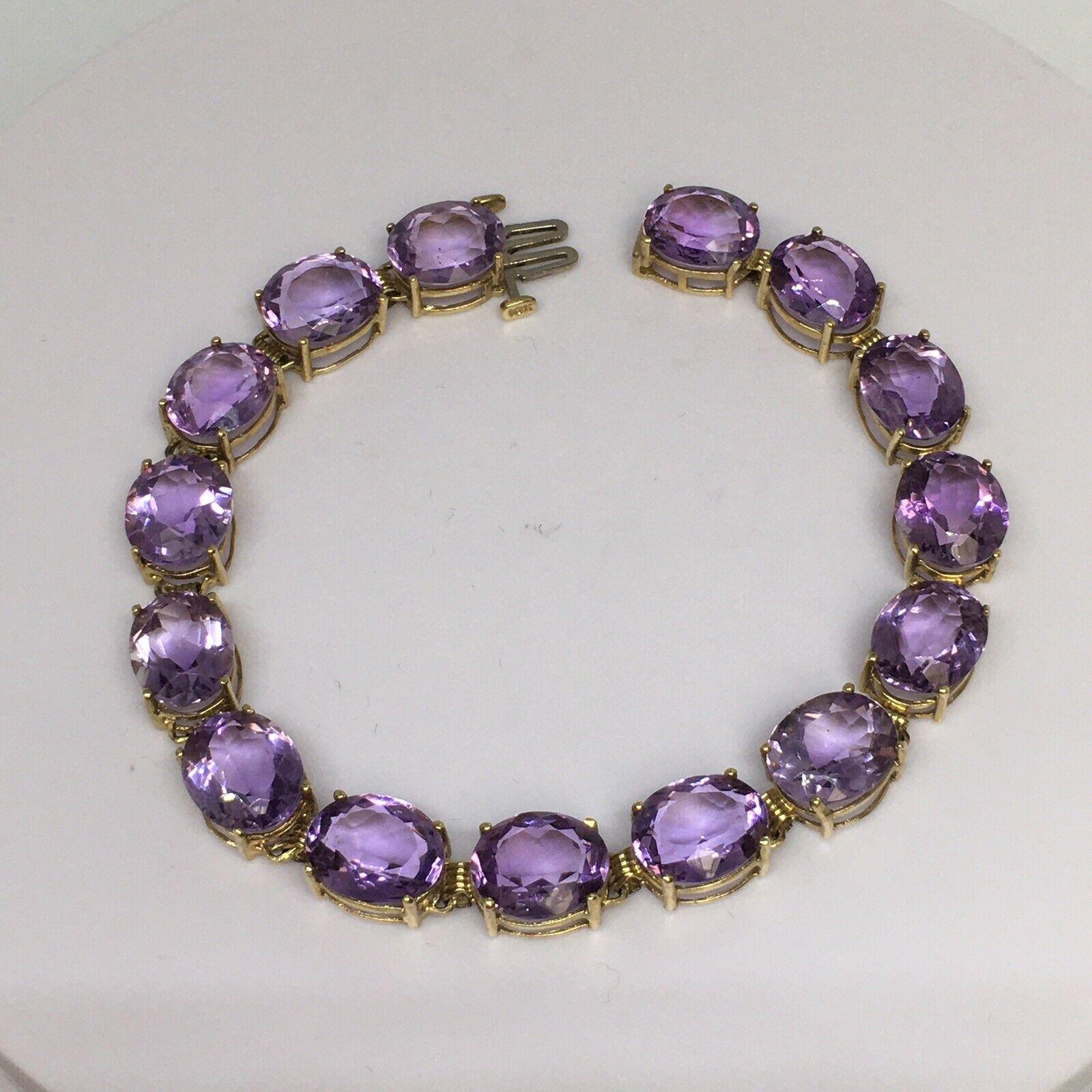 10K gold 11 mm by 9 mm 38 Ct Oval Natural Amethyst Tennis Bracelet Women 8 inch

15 stones, 11 mm by 9 mm, oval amethysts approximately 38 Carats
8 inch long
Weighting 19.4 gram
All in good condition, no damage, no evidence of repairs, see pictures
