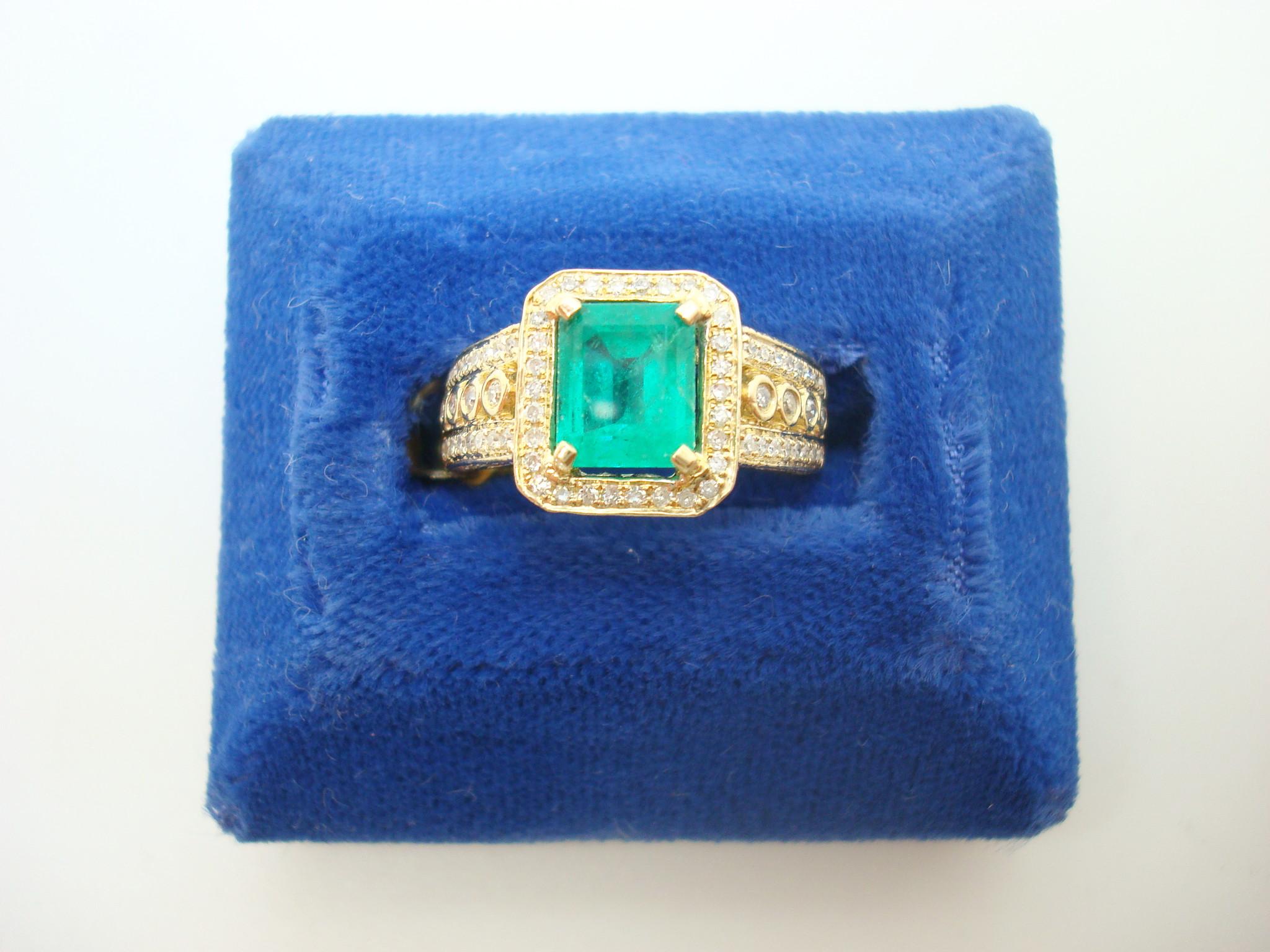 10k Gold 1.62ct Genuine Natural Emerald Ring with 1/4ct Diamonds (#J2604)

10k yellow gold ring featuring a 1.62 carat emerald cut emerald with fabulous grass green color. It measures 7x6mm. The emerald is accented by round diamonds measuring 1-2mm
