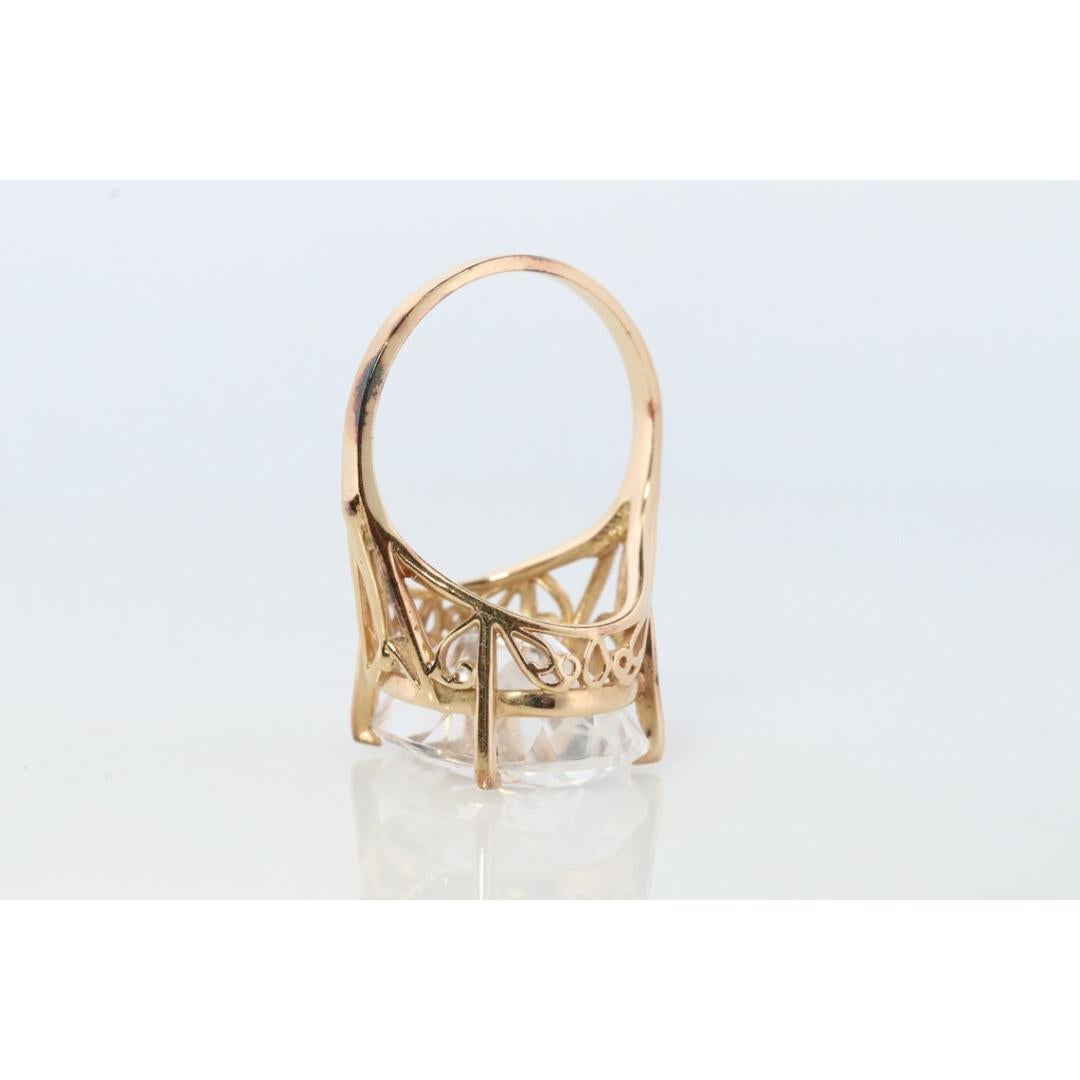 Vintage from the 1980s
Materials: Ceramic, Gold
Gemstone: Topaz
Gem color: Colorless
Band color: White
Beautiful Solitaire Ring. Bright Colorless center White Topaz.

Made by CID Clyde Duneier

Condition: Shows limited signs of wear.

Details:
14mm