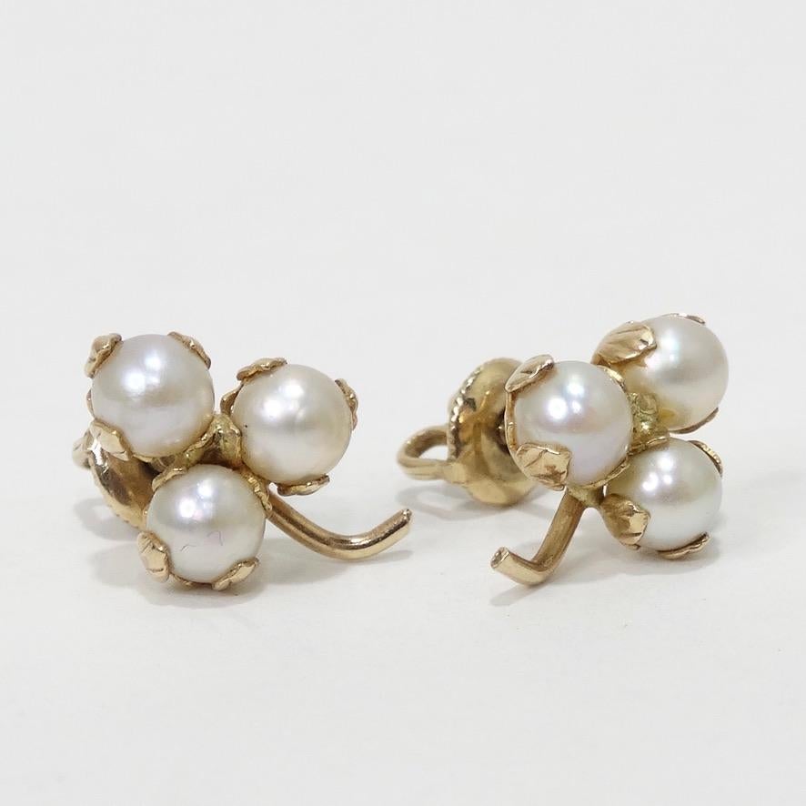 Timeless and elegant 10K gold pearl stud earrings. Featuring an understated arrangement of three pearls in a cherry shape complimented  by gold hardware and lever backs. These earrings are so classic and versatile, truly a must have for any vintage