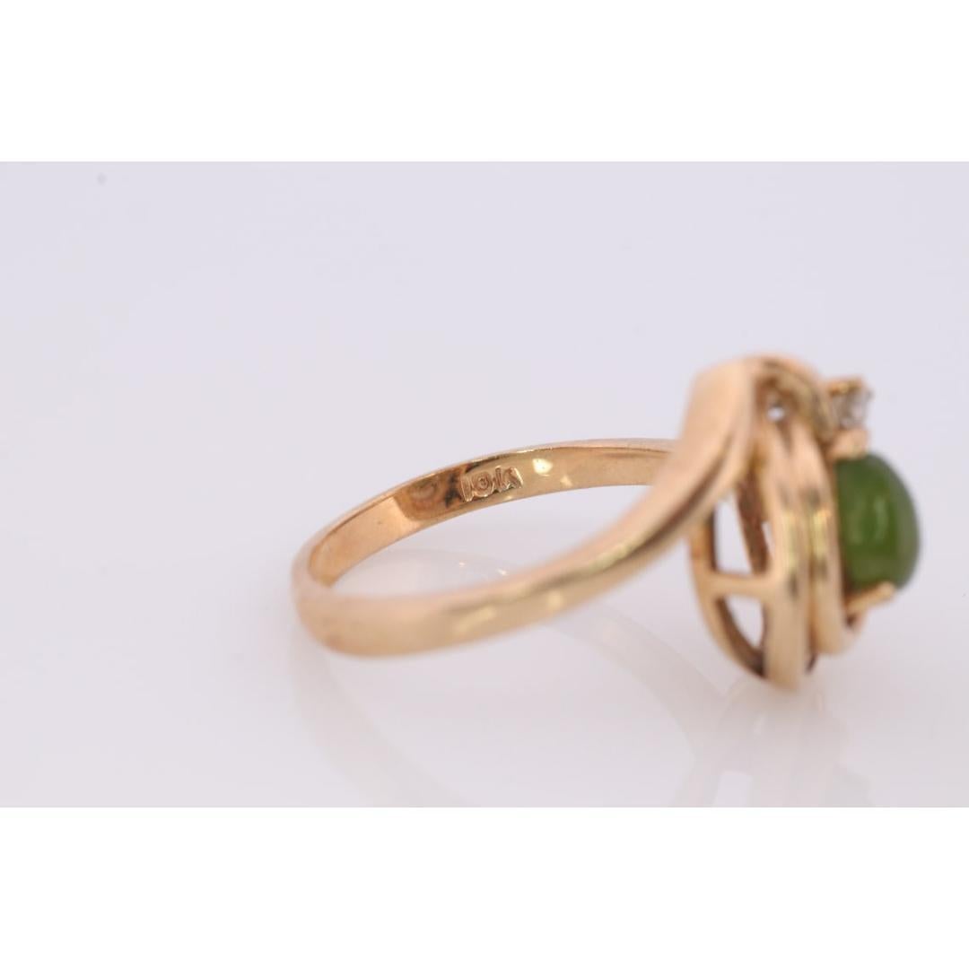 Vintage from the 1990s
Materials: Stone
Gemstone: Jade
Gem color: Green
Style: Minimalist
Wonderful Apple Green Jade Cabochon ring. Jade is translucent green color. Prong set. Diamond accent on the top.


2.7grams total weight
4mm by 6mm pear