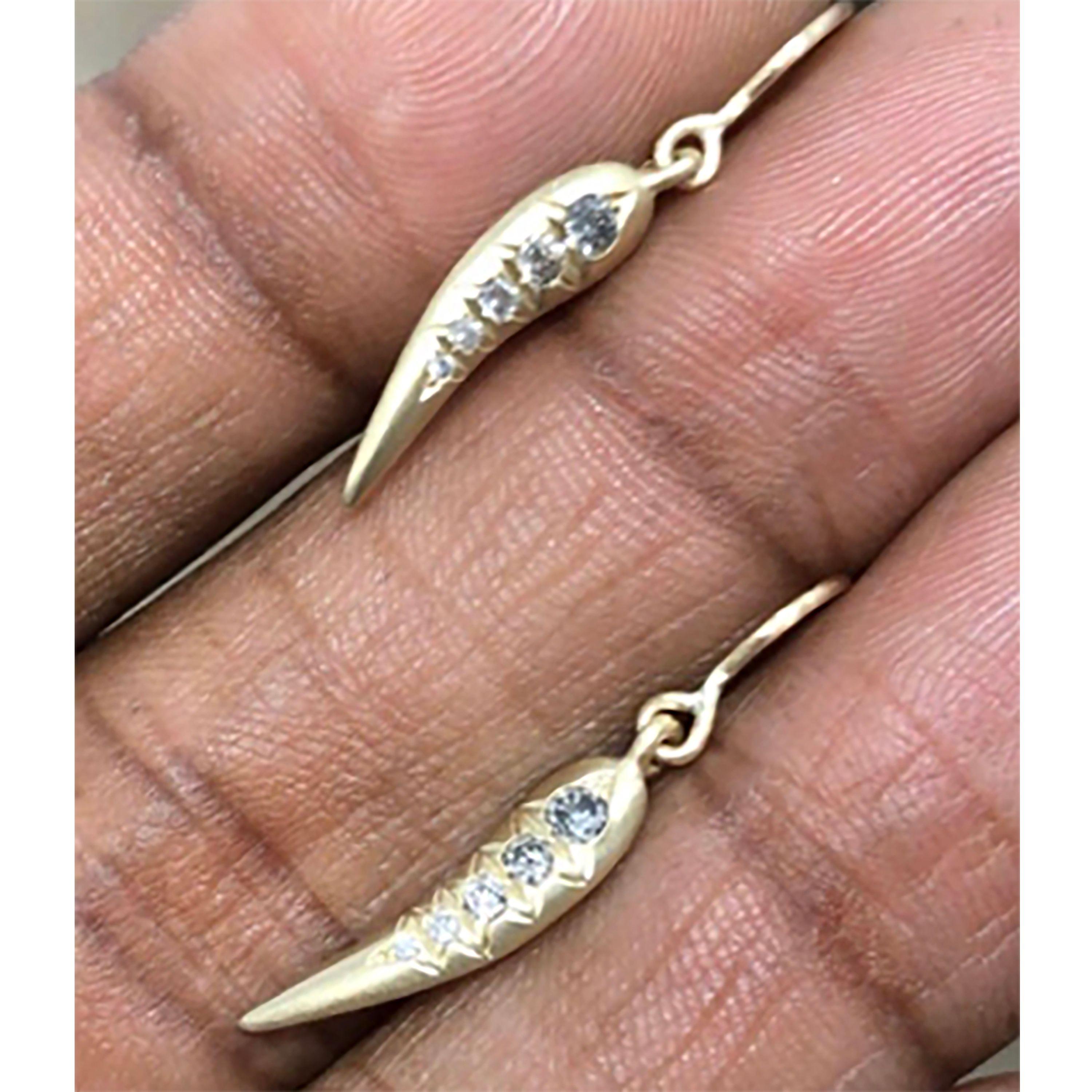 10K Chili Earrings diamonds graduate from a darker salt & pepper grey, medium tone grey, down to light hints of grey and finally white diamonds.

Delicate, fine solidity with hints of the past.

Danyell Rascoe's fascination for gems began as a young