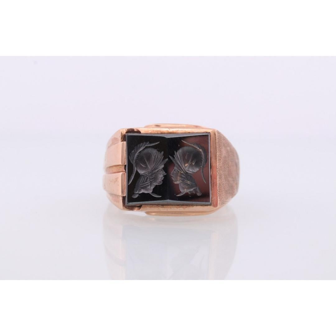 Vintage from the 1930s
Size: 12 US
Materials: Stone
Gemstone: Hematite
Gem color: Champagne
Band Color: Bronze

Style: Art Deco

Amazing Heavy Hematite carved ring. Very unique Jet black gemstone. I have not seen one like it. Intaglio head carving