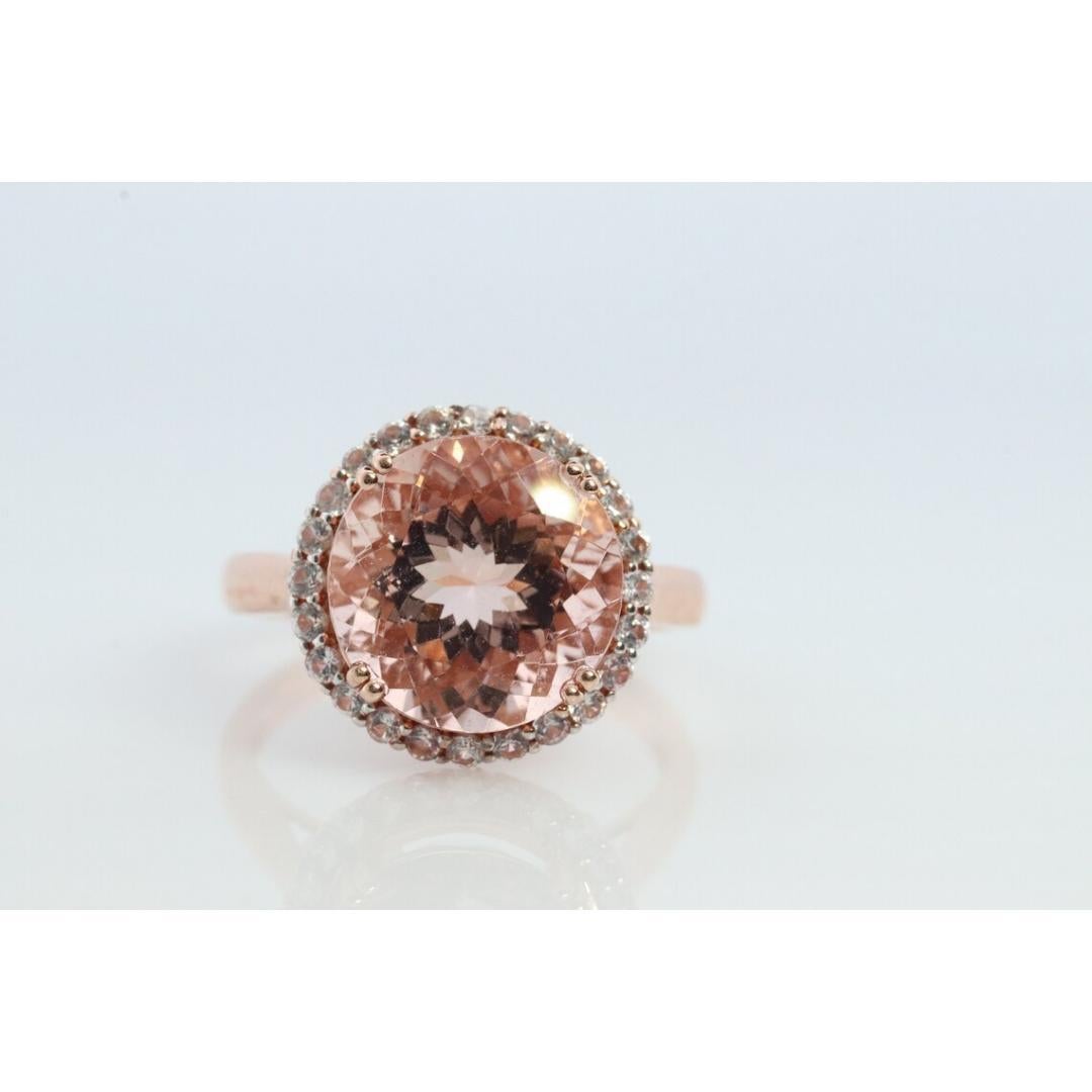 Vintage
Size: 9 US
Materials: Stone
Gemstone: Morganite

Style: Mid-century

Beautiful Ring. Composed of Round Morganite and a tiny halo White Sapphires.

Condition: Show no signs of use.

Details:
1.5 mm white sapphires
11mm round