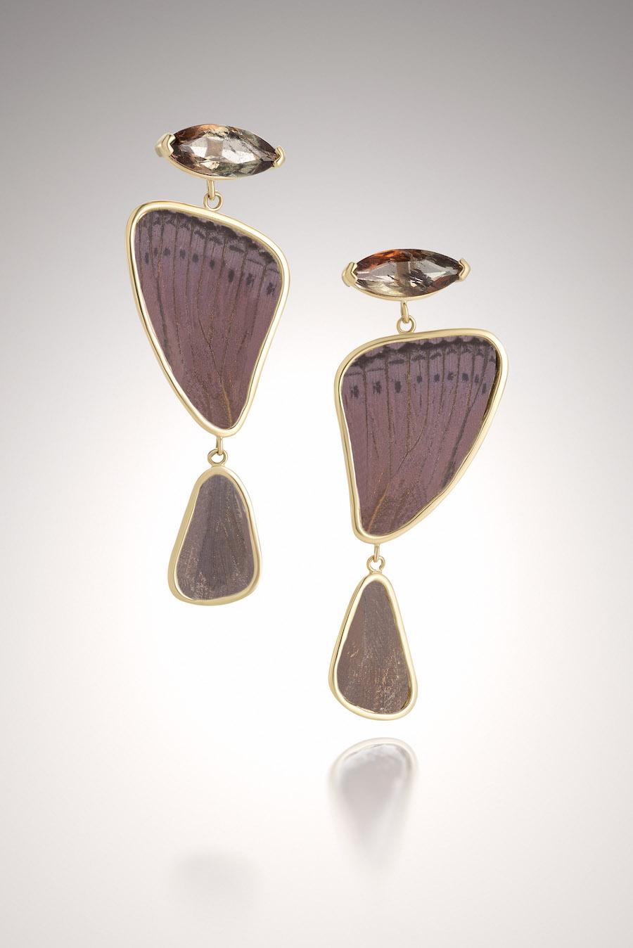 10K, Purple Butterfly wings protected by a layer of sheet Mica with marquee cut Andalusite's (3.05 CTW) are uniquely one-of-a-kind pair of earrings.  The purple brownish color of the color changing Andalusite's play off the purple butterfly wings. 