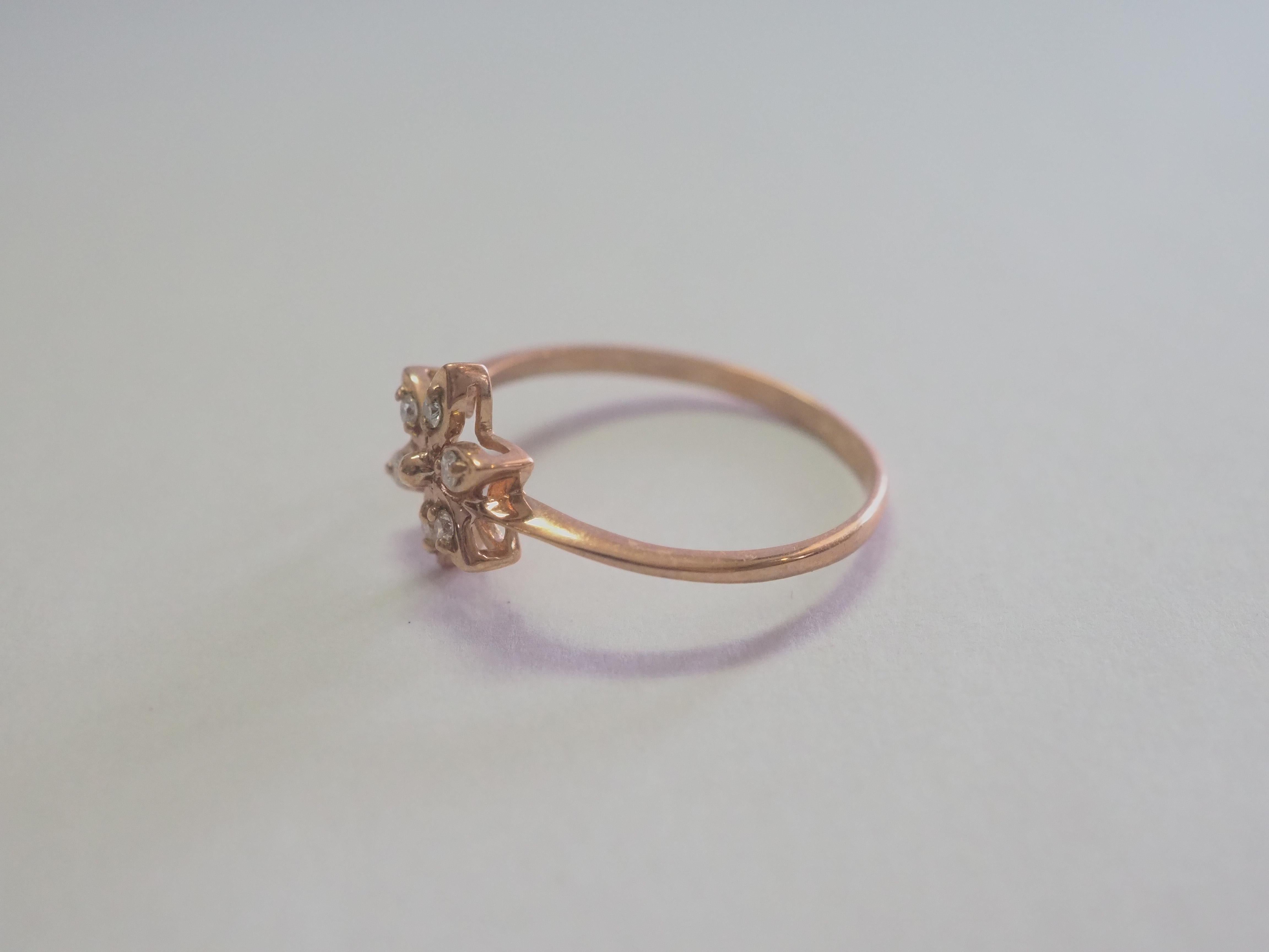This fine dainty band ring piece is perfect for wearing everyday. There are a total of six round and bright diamonds set inside. The diamonds are very clear and bright. The design is a contemporary with flower design. The design has femineity and