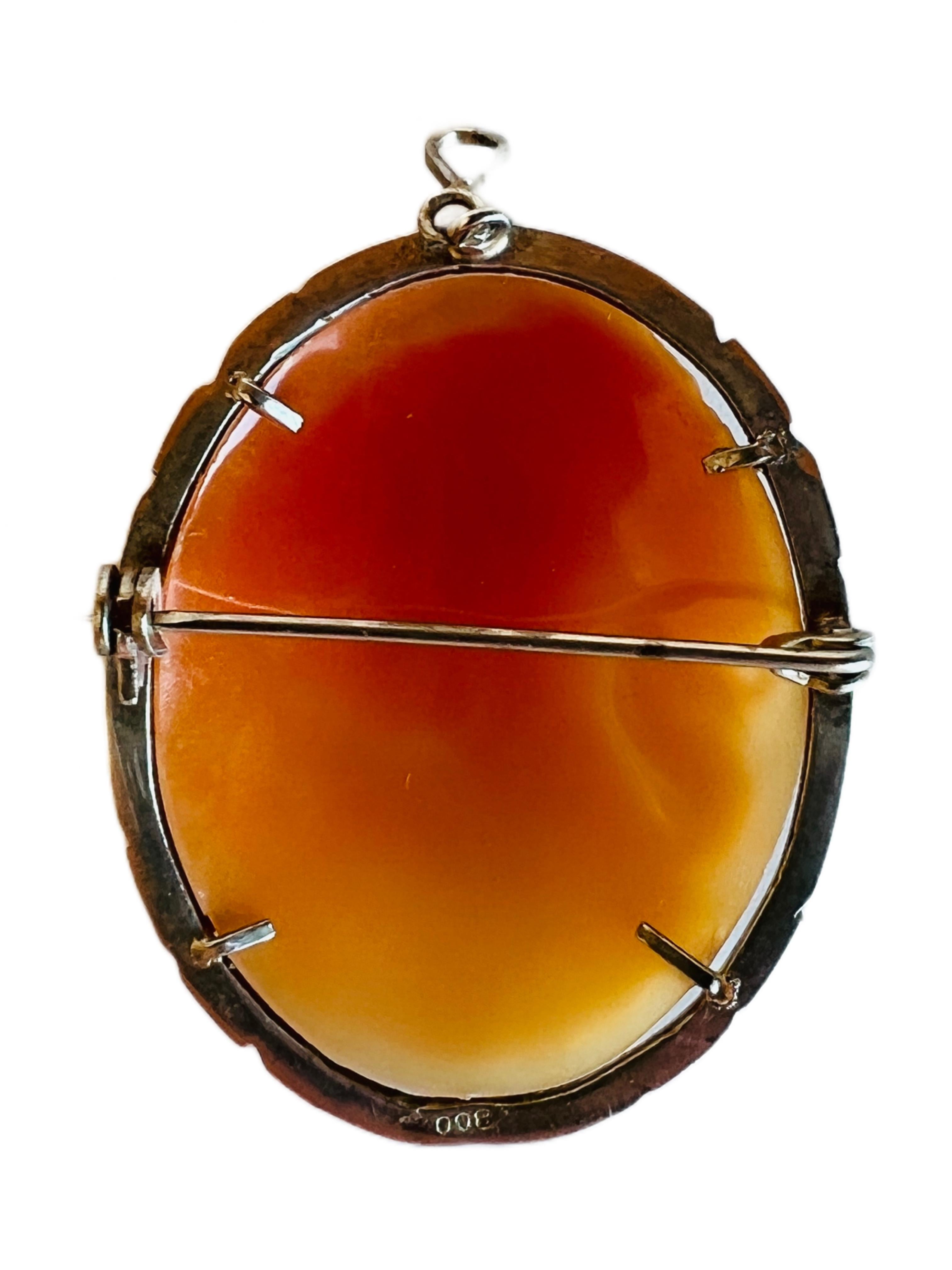 Detailed cameo shell brooch and necklace pendant adorned with marcasites.

Weight: 5.7 grams.
Size: 1-1/2