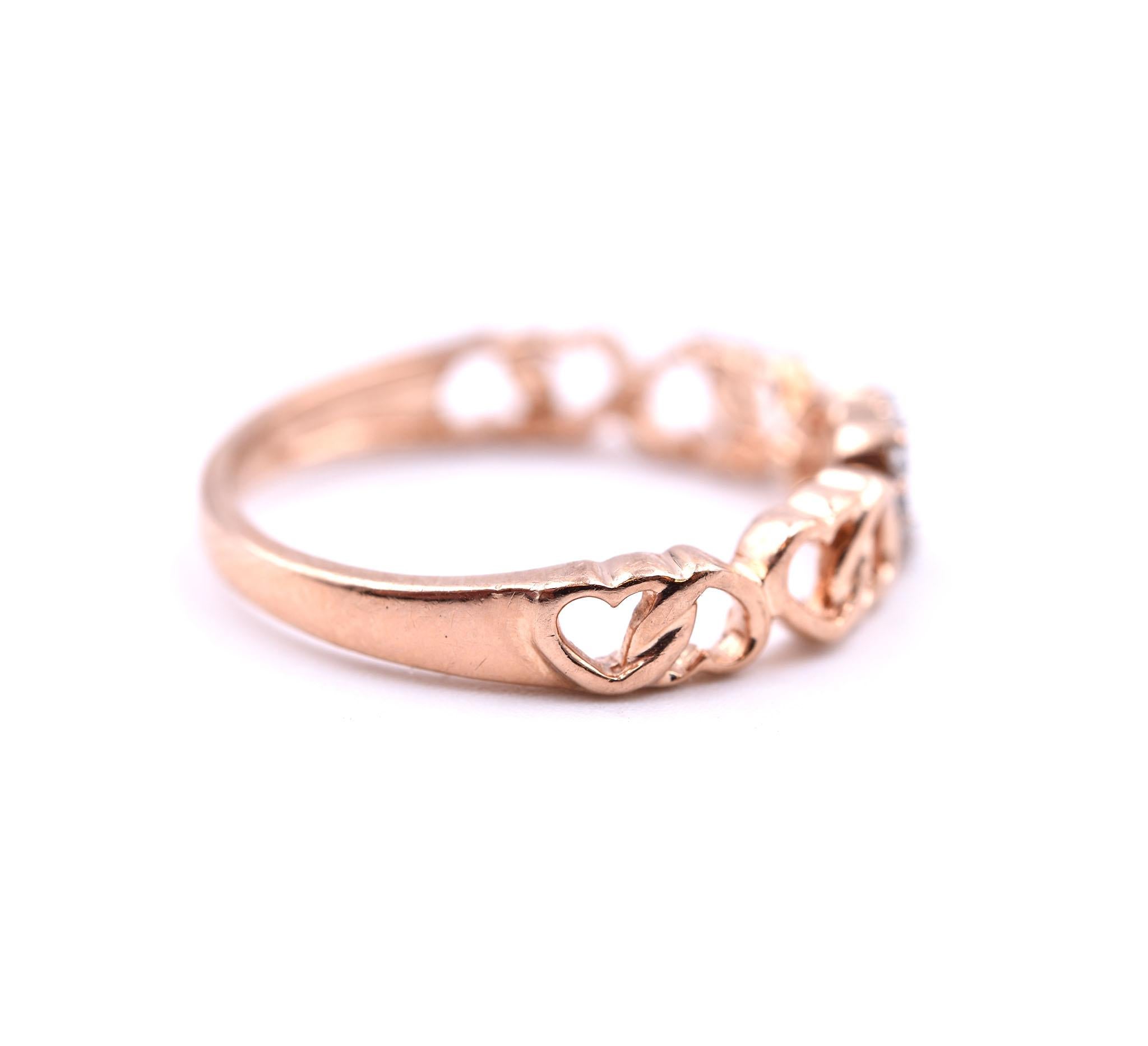 Designer: custom design
Material: 10k rose gold
Diamonds: 11 round brilliant cut= .06cttw
Color: G
Clarity: VS
Ring size: 6 ½ (please allow two additional shipping days for sizing requests)
Weight: 2.13 grams 
