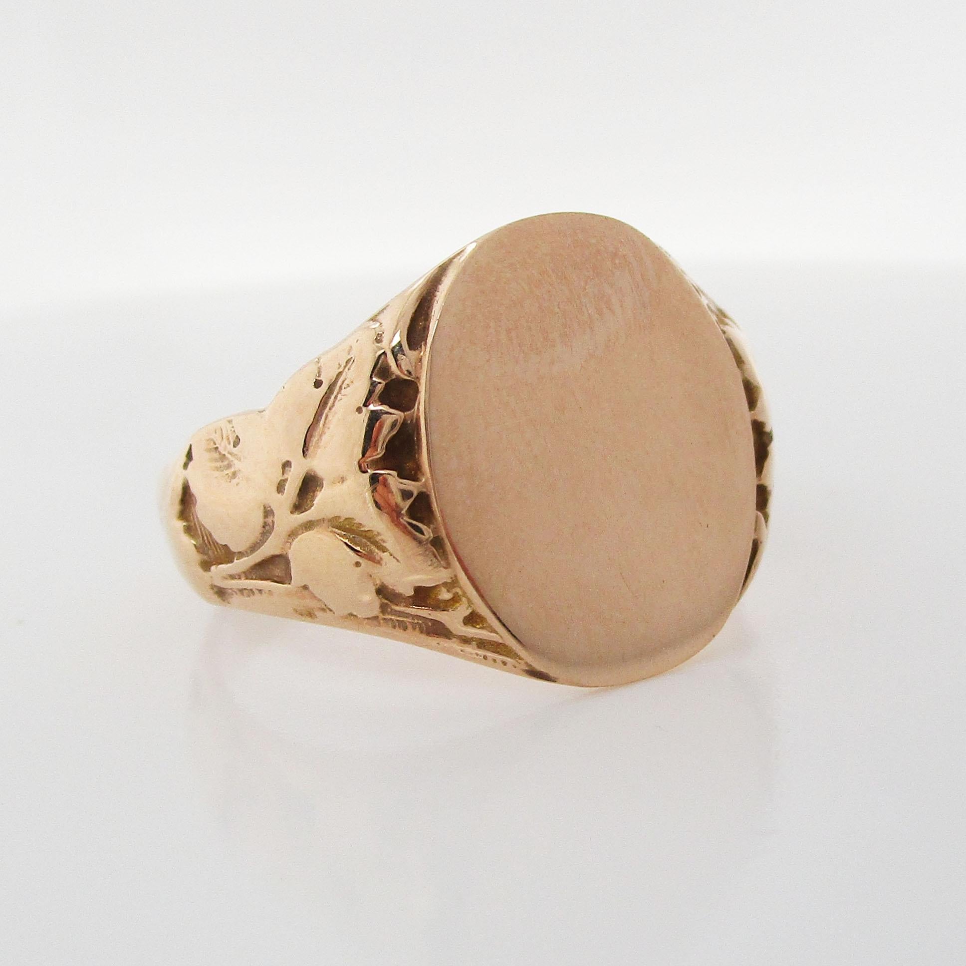 This is a magnificent Victorian signet ring in 10k rose gold with elegant engraved details. The engraved shoulders have a distinguished leaf motif that adds to the overall elegance of this beautiful piece. The ring has an excellent weight and feel