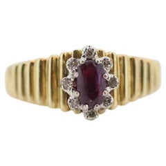 10k Ruby and Diamond HALO ring. 10k Yellow Gold Ribbed shank Ruby Halo ring.