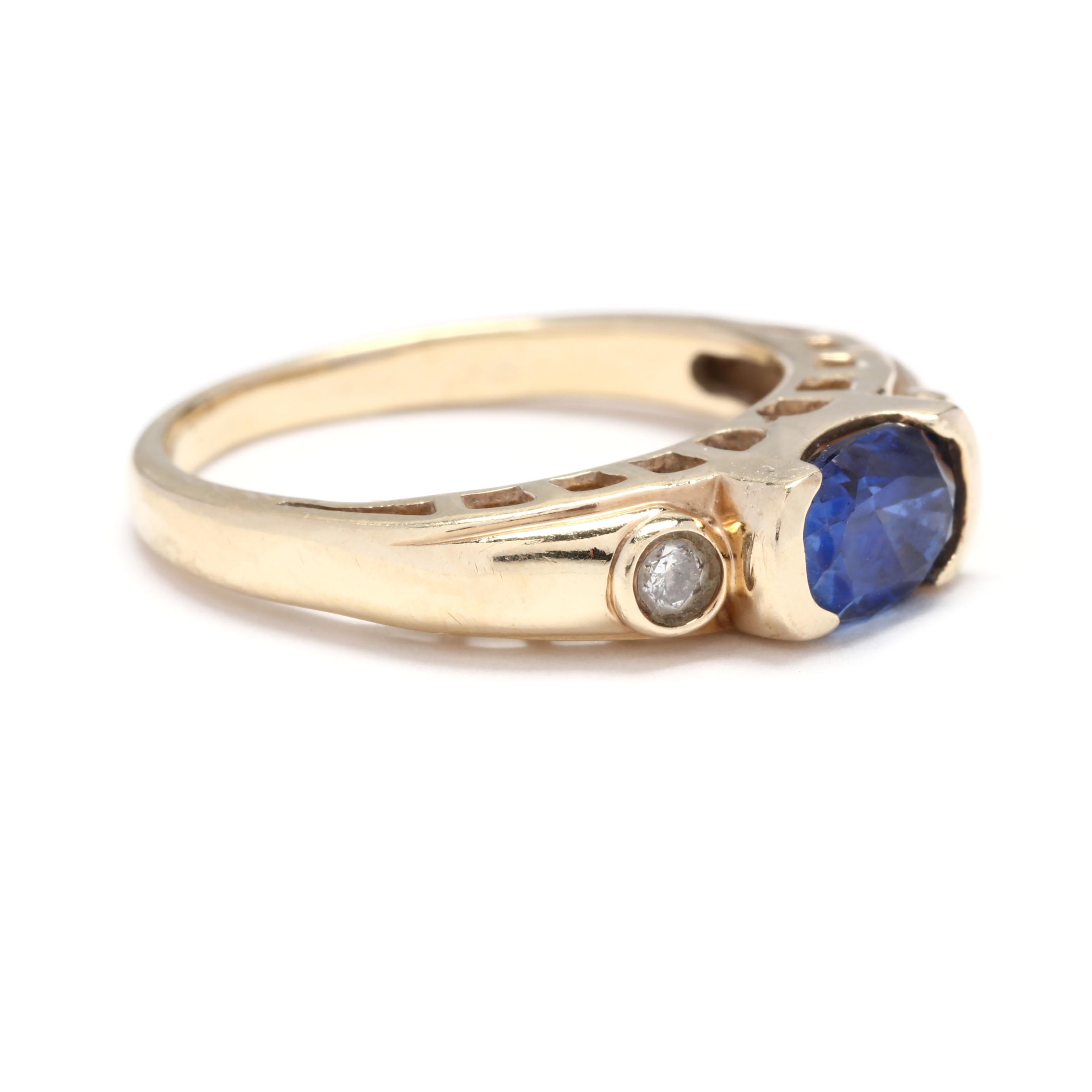 An estate 10 karat yellow gold blue stone and diamond ring. This ring features a horizontal, half bezel set oval cut blue stone with a bezel set full cut diamond on either side and a tapered shank.



Stones:

- blue stone, 1 stone

- oval cut

- 7