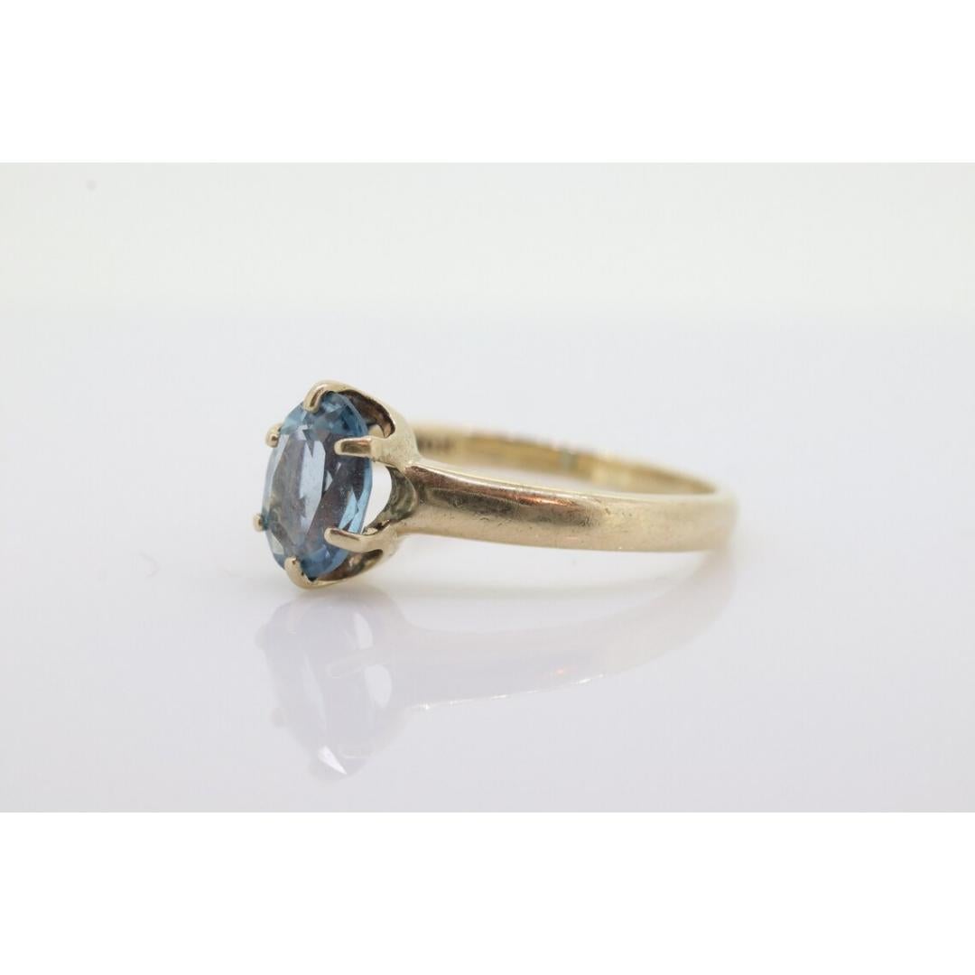 10k Topaz Solitaire Ring. 10k yellow gold HANDWROUGHT Blue Oval Topaz solitaire In Good Condition For Sale In Port Charlotte, FL