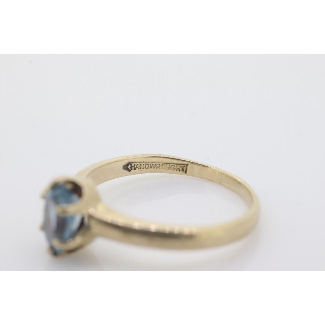 Women's 10k Topaz Solitaire Ring. 10k yellow gold HANDWROUGHT Blue Oval Topaz solitaire For Sale