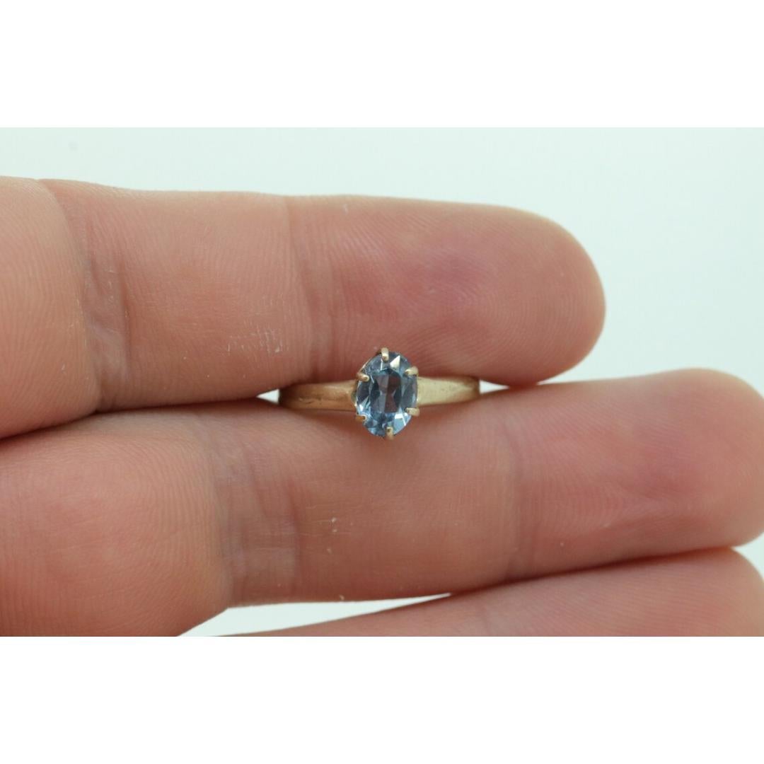 10k Topaz Solitaire Ring. 10k yellow gold HANDWROUGHT Blue Oval Topaz solitaire For Sale 3
