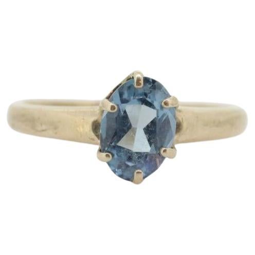 10k Topaz Solitaire Ring. 10k yellow gold HANDWROUGHT Blue Oval Topaz solitaire For Sale