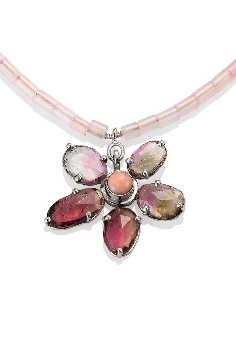 10K White gold prong set 5 rose cut tourmaline (5.75 carts) flower petals with a coral center, all strung with pink quartz beads, 18' long. And a solid 14K white gold lobster claw clasp. The inspiration for this Tourmaline Flower necklace was the