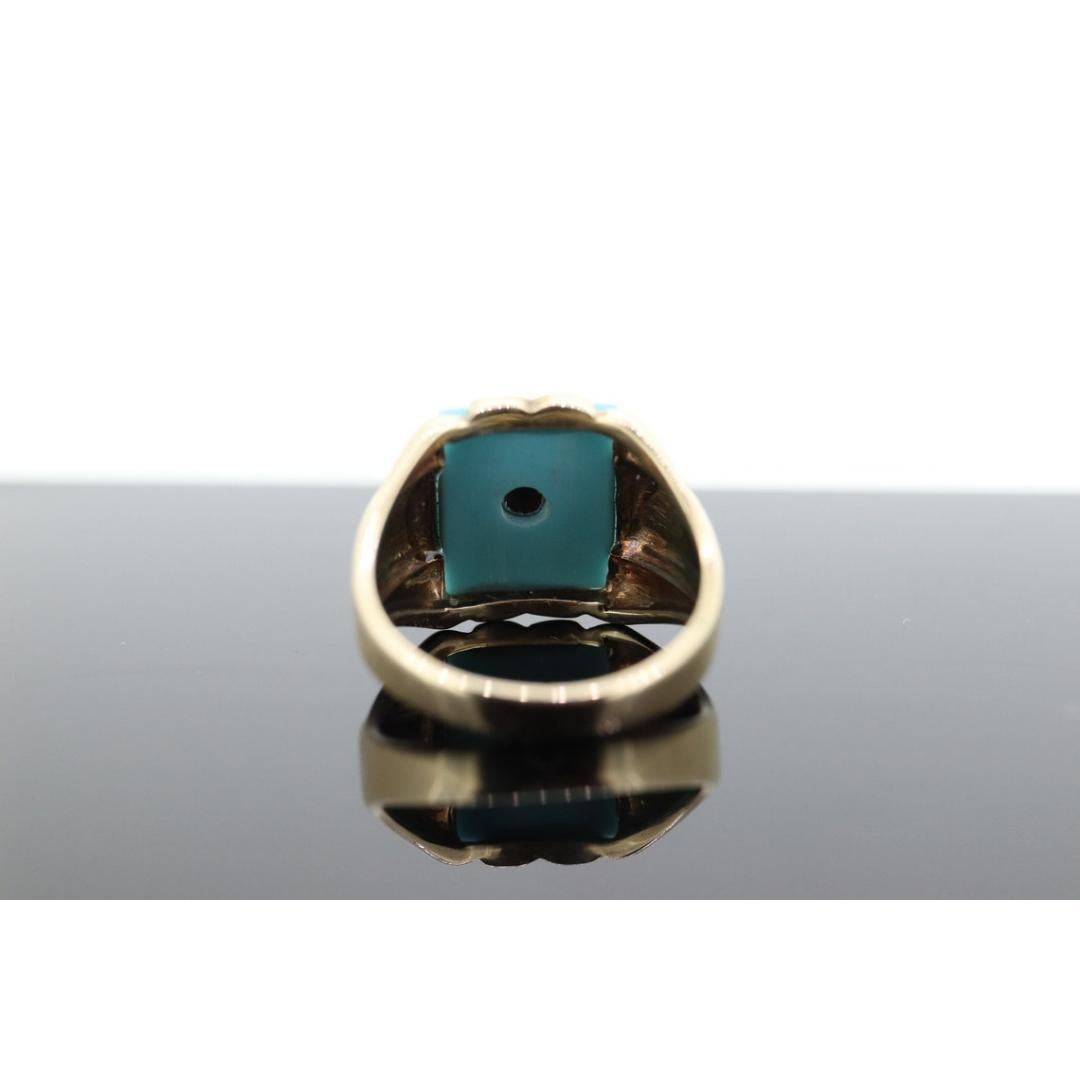 Vintage from the 1960s
Size: 10 US
Materials: Gold
Gemstone: Turquoise
Gem color: Black

Band color: Gold

This is a super unique ring. Mens Turquoise and diamond center ring.

Multi-tone gold with Yellow, rose gold shoulders and green