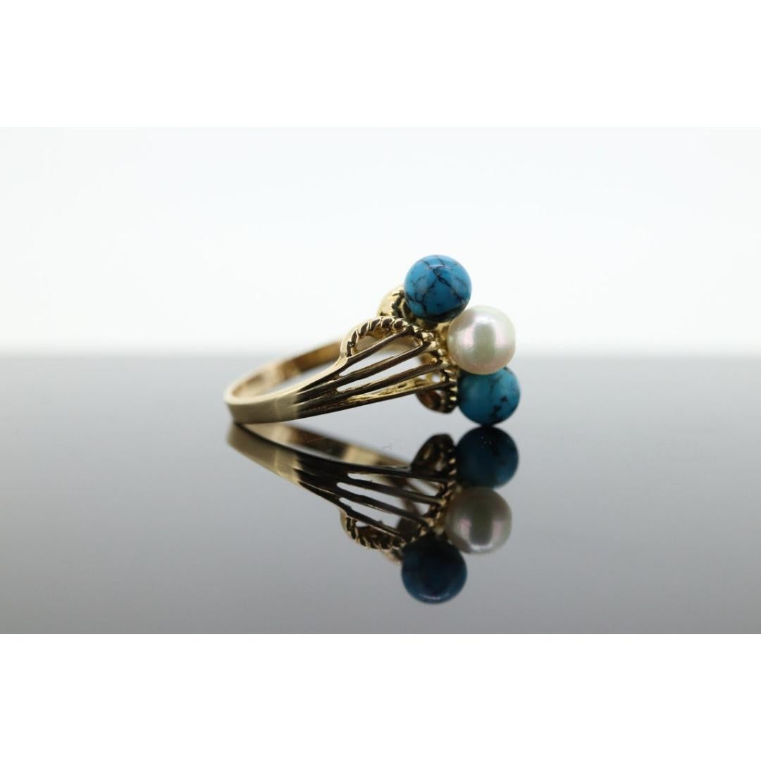 Vintage
Size: 7 US
Materials: Gold
Gemstone: Turquoise

Gem Color: White

About this item

Beautiful Natural Turquoise and Pearl set into 10k Gold.

Details:
3.4 grams total weight
6mm Turquoise beads
6mm Pearl