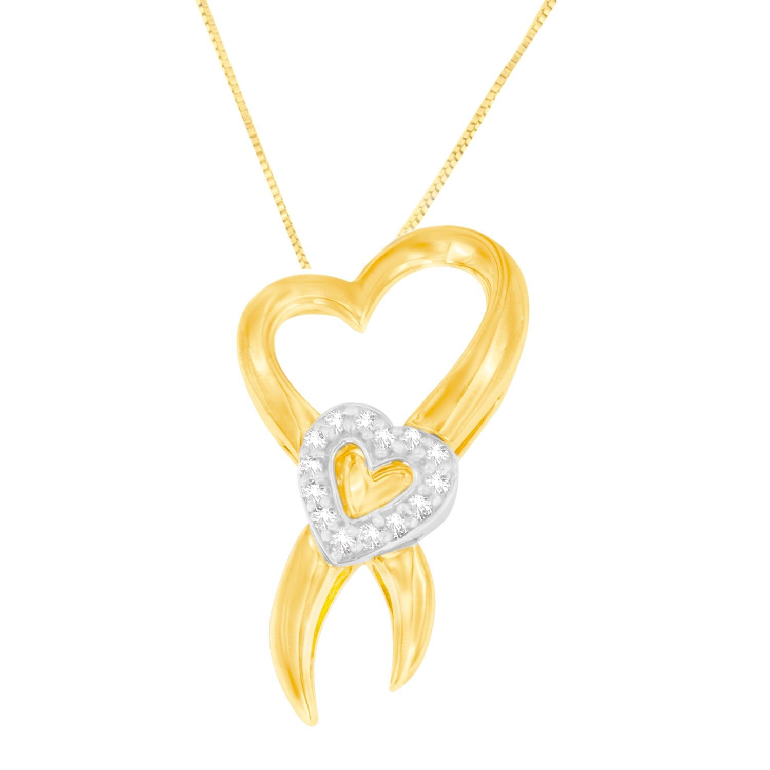 Certain to bring a smile on her face, this ribbon-shaped pendant features a heart accent in the center. The ribbon framing is crafted of 10 karats yellow gold, and the heart accent is adorned with ten karats white gold. Further, the lovely heart in