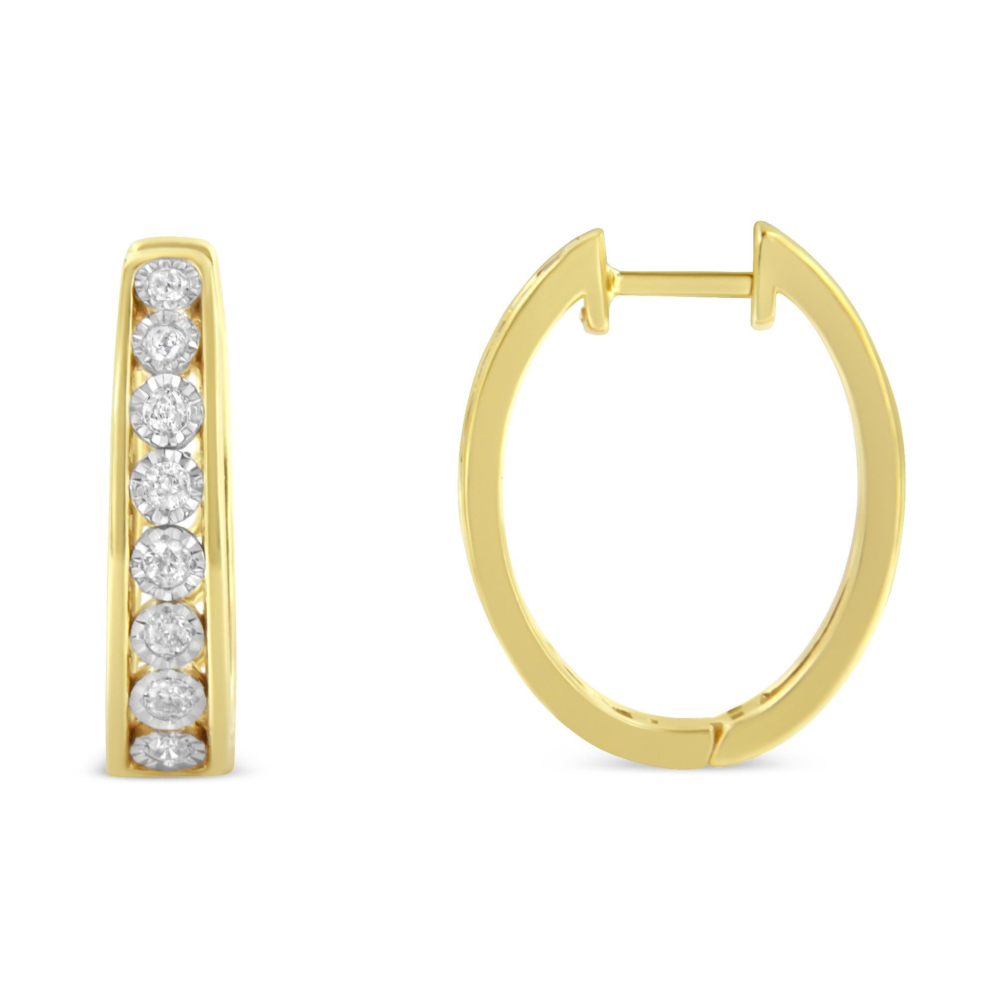 Brilliant diamonds set in 10 karat two-tone gold add sparkle to this pair of elegant hoop earrings. Each earring features eight round diamonds set in a miracle setting. The total diamond weight is .49 carats. They are built with leverback closures.