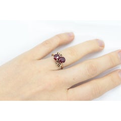 10k Victorian Claw Set Ruby Ring. Twin gem bypass bow ring