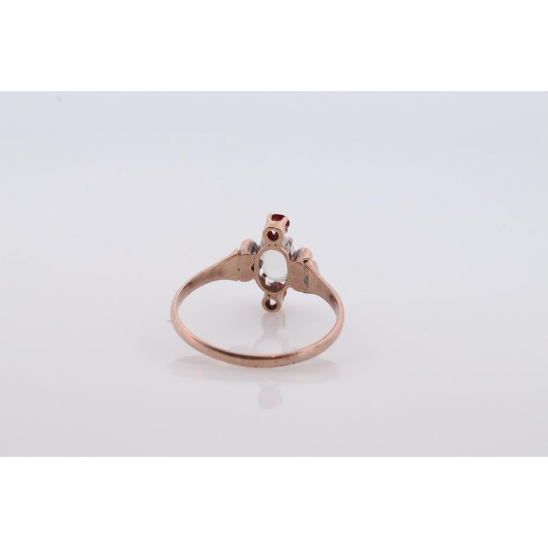 Vintage from the 1900s
Size: 6 US
Materials: Gold
Gemstone: Moonstone
Band Color: Gold

Style: Victorian

Amazing MOONSTONE. Sphere Cabochon set into a Victorian Claw with small side garnets and pearl seeds.

Condition: Excellent condition for the
