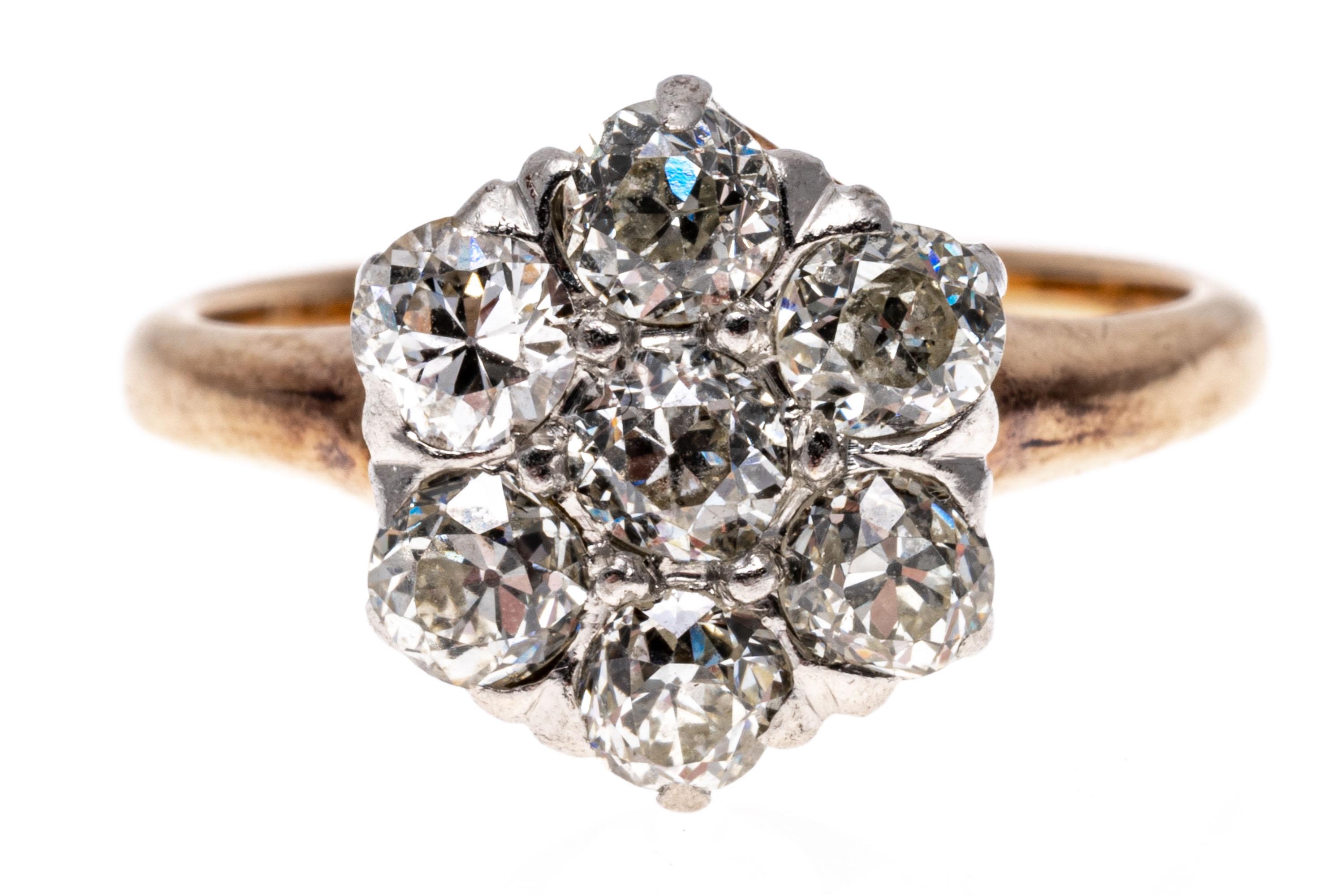10k rose and white gold ring. This beautiful vintage ring is a round diamond cluster, set with old European cut diamonds, VS to SI clarity, approximately 0.56 TCW and prong set.
Marks: None, tests 10k
Dimensions: 5/16