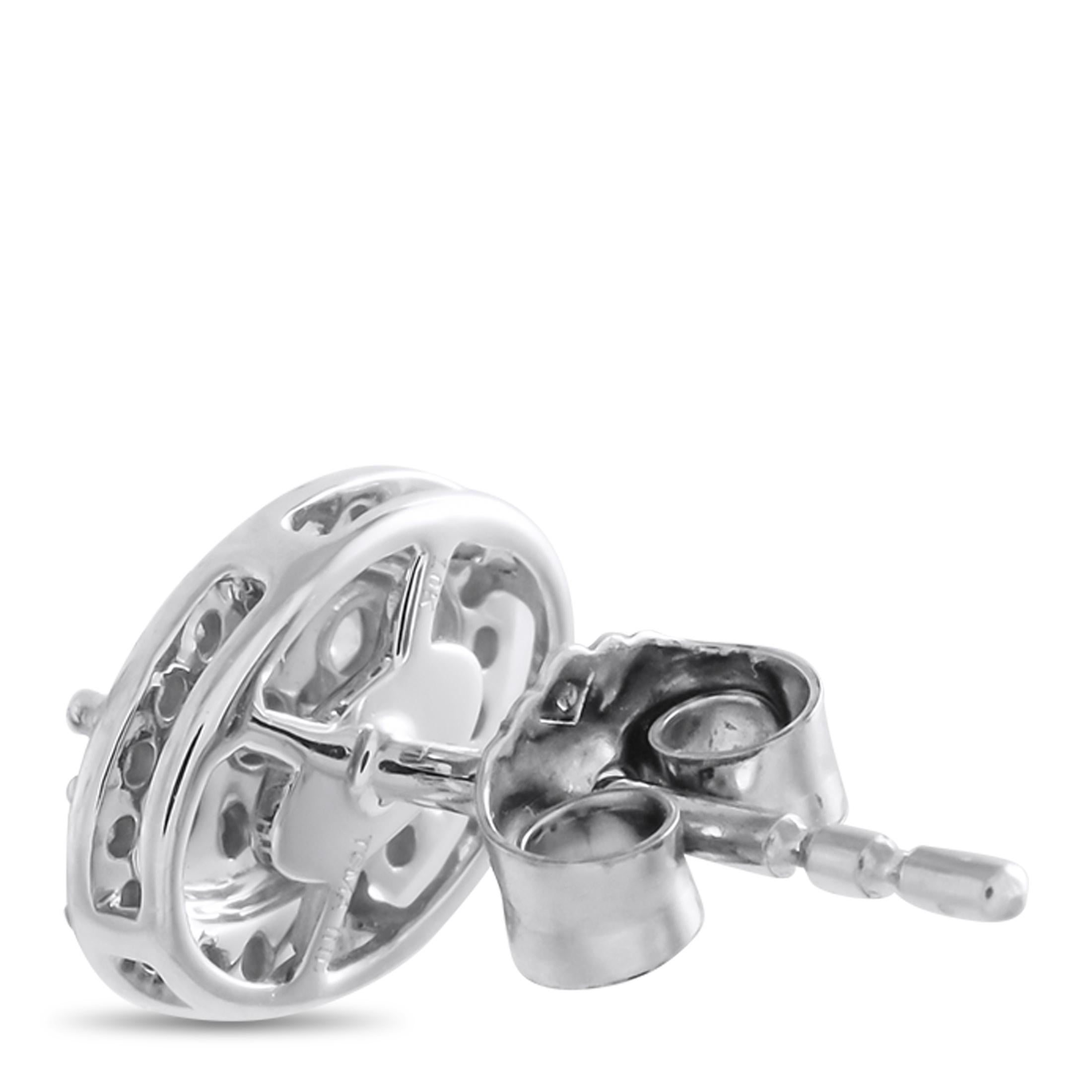 These earrings possess a timeless elegance that will never go out of style. Each one comes complete with an intricate oval-shaped 10K White Gold setting that measures 0.47 long by 0.35 wide. Diamonds with a total weight of 0.25 carats allow them to