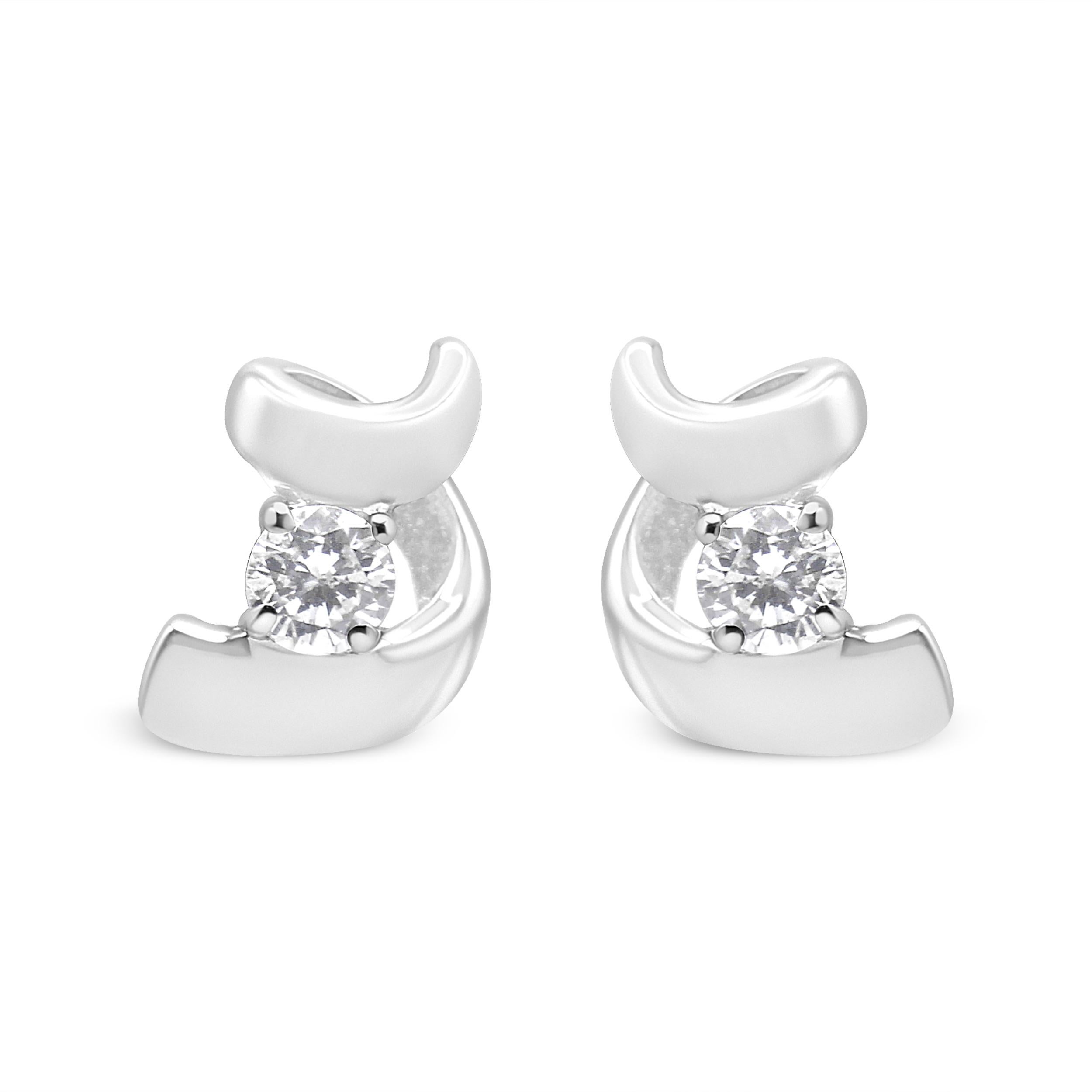Add sparkle to your look with these solitaire earrings. Crafted in 10k white gold, these earrings display 1/10 carat TDW of round cut diamonds. A glittering prong set diamond sits in the middle of a white gold ribbons that twists and creates a