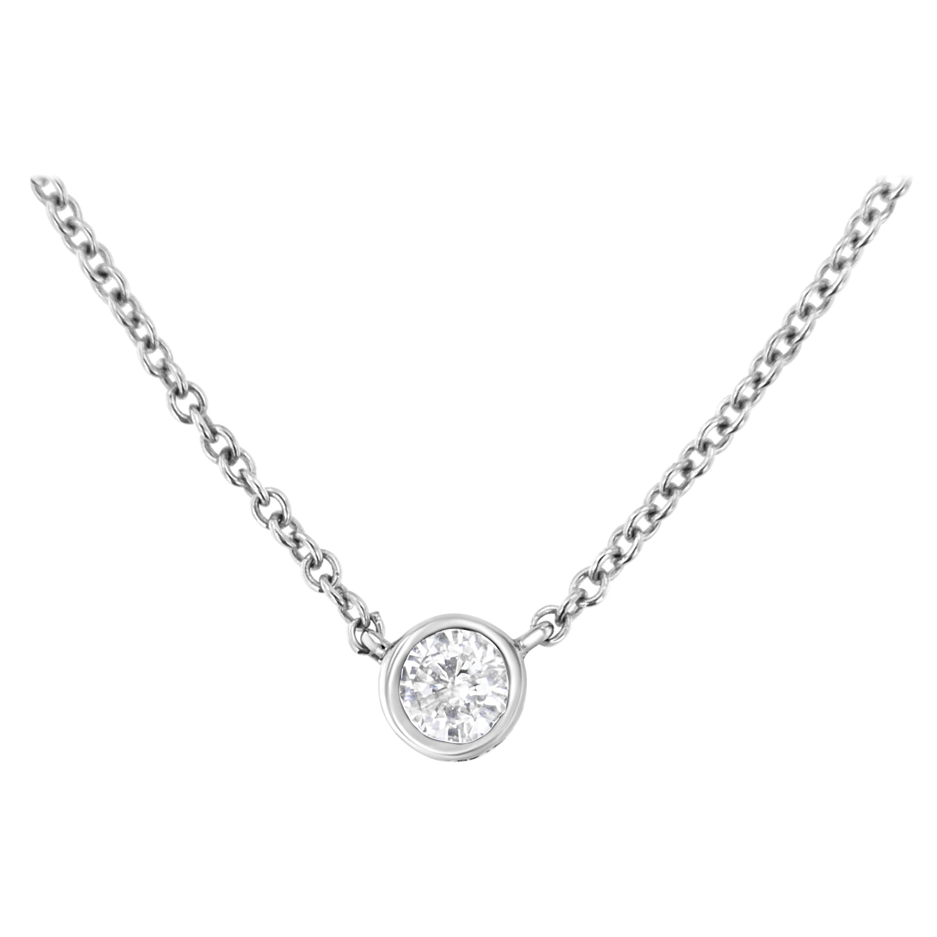 10k White Gold 1/10 Cttw Bezel Round-Cut Diamond Solitaire Pendant Necklace For Sale