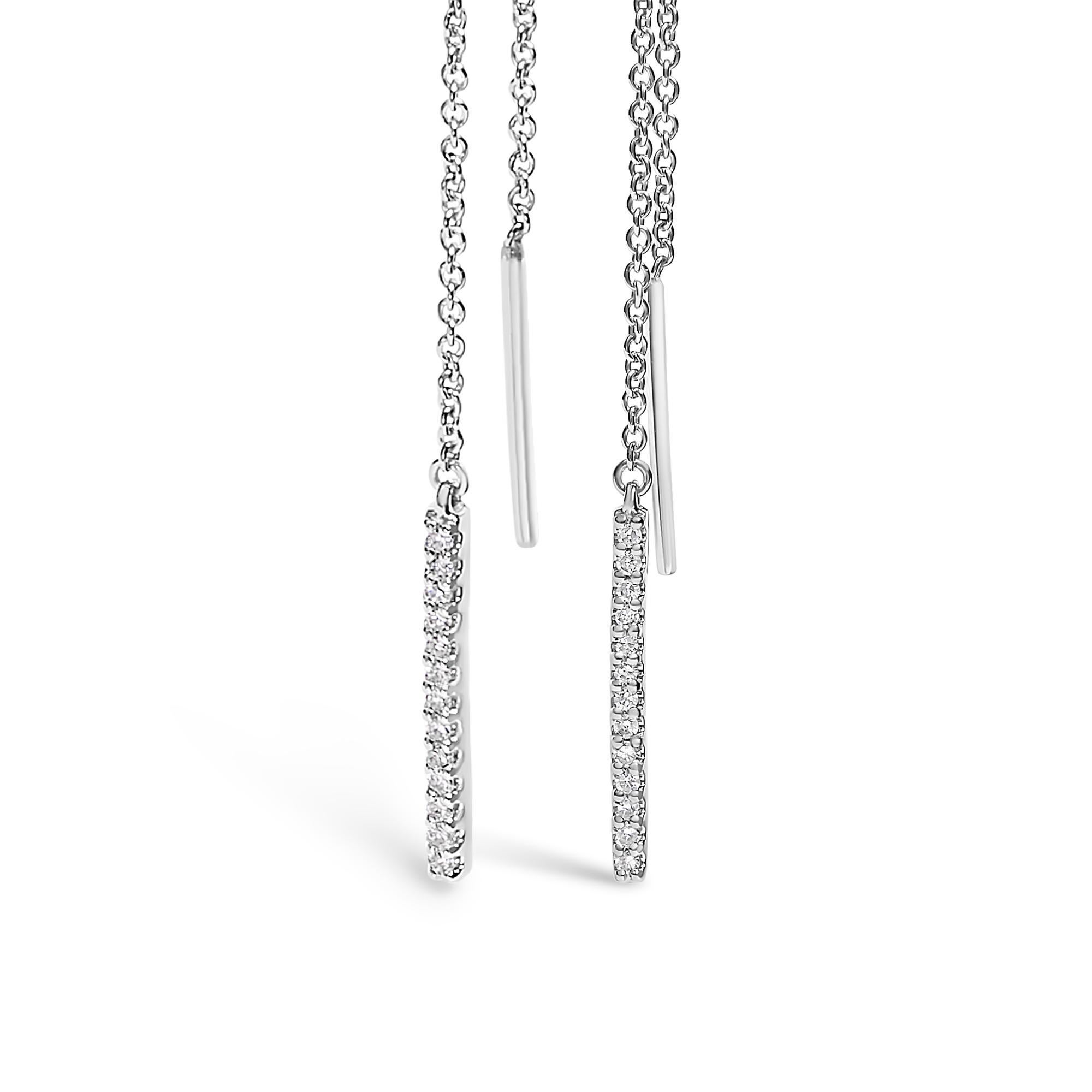 Discover the serene elegance of these 10K white gold threader earrings, where sophistication meets modern design. Each piece invites the light to dance along its rhodium-plated, exquisite elongated chain that smoothly threads through the ear,