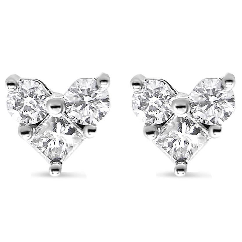 Elegant and petite, these gold and diamond heart studs are the perfect accessory for everyday wear or for any formal occasion. Beautifully set in 10k white gold, a metal that will stay tarnish free for years to come, these earrings are set with 2