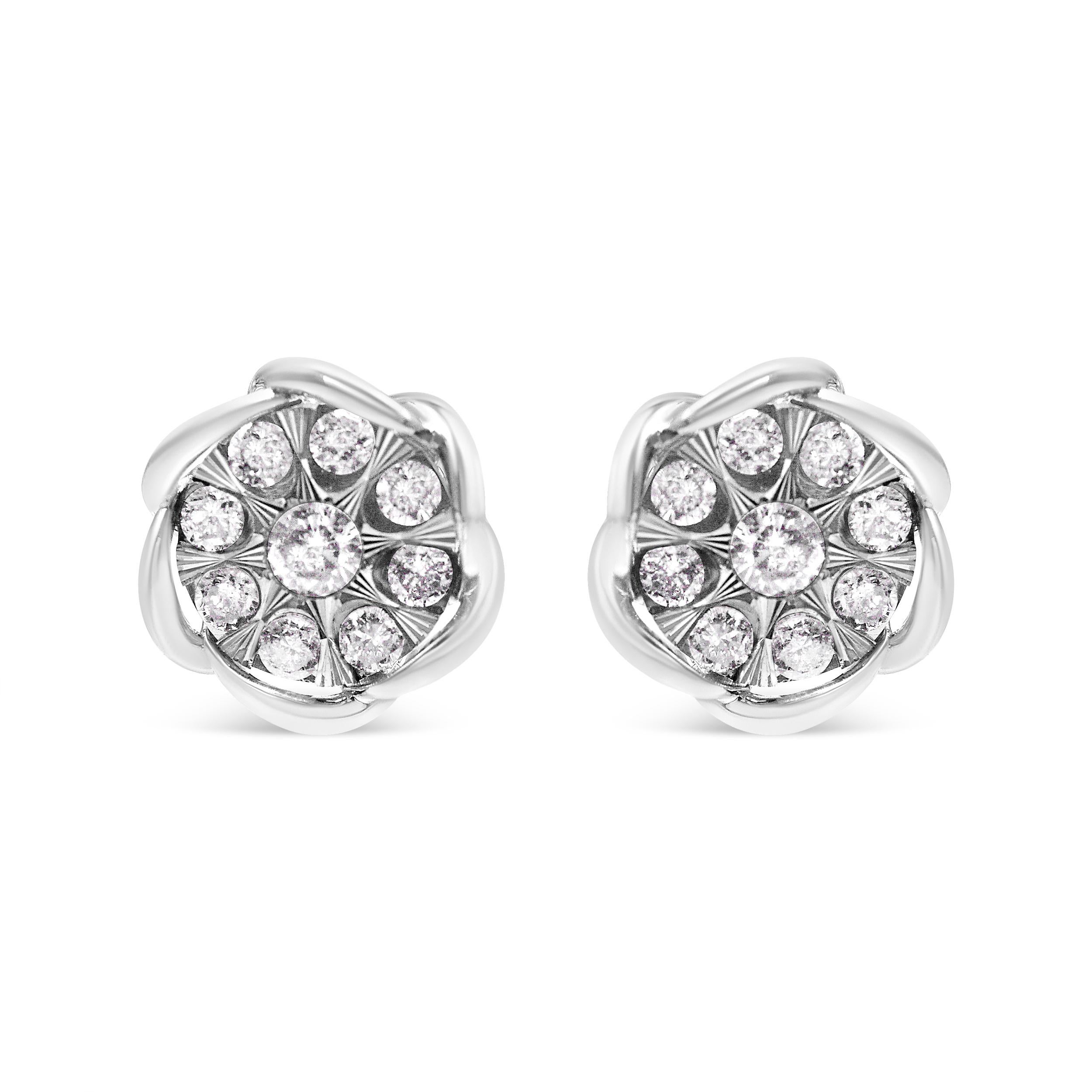 Elevate your everyday look with these modern floral 1/2 c.t. diamond studs. These earrings are each set with 9 round-cut diamonds in a spaced-out, floral design. The central stone is larger than the stones flanking it, and the flower design is