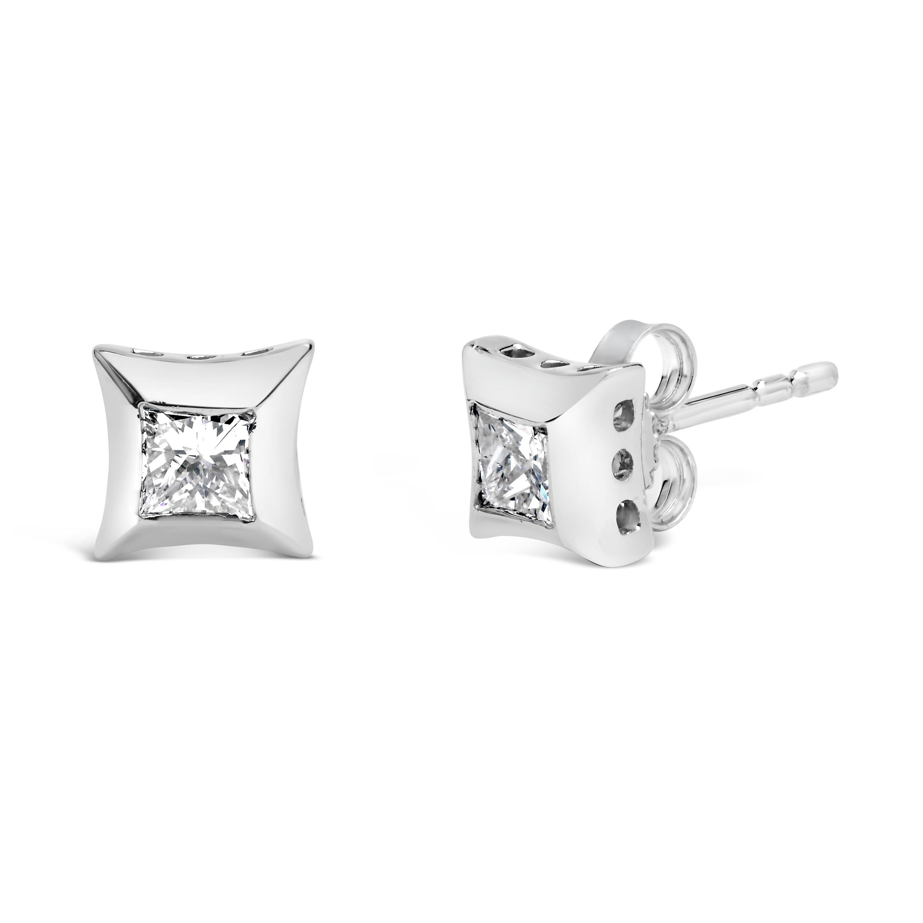 Introducing a dazzling masterpiece crafted to perfection, these 10K White Gold Solitaire Stud Earrings are an exquisite addition to any jewelry collection. With a total diamond weight of 1/2 cttw, the two princess-cut diamonds shimmer brilliantly,