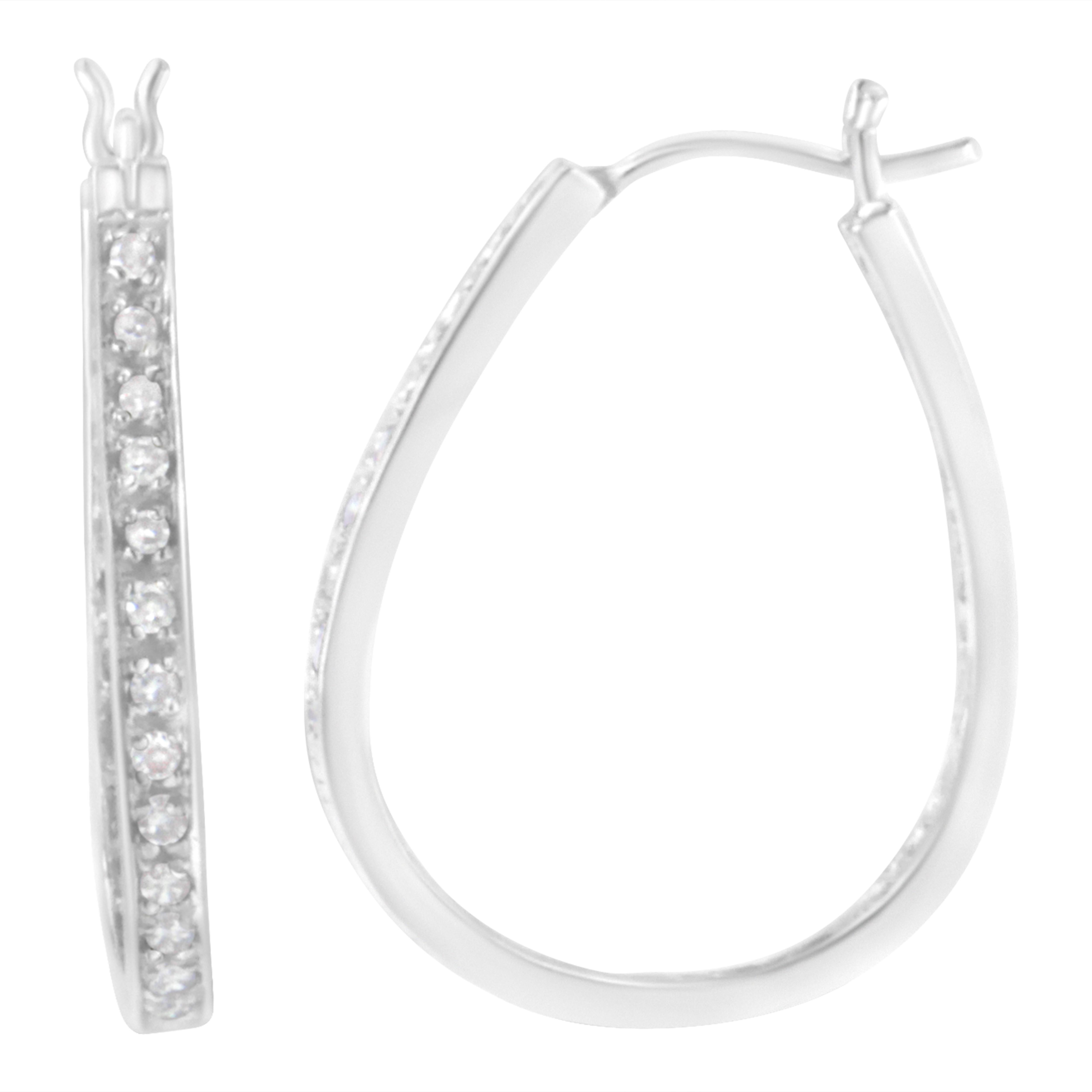 Beautiful, natural round-cut diamonds embellish the outer and inner layer of these stunning 10k white gold hoop earrings. This piece has a total diamond weight of a 1/2 cttw, and is the perfect gift for a loved one. The diamonds shine in a prong