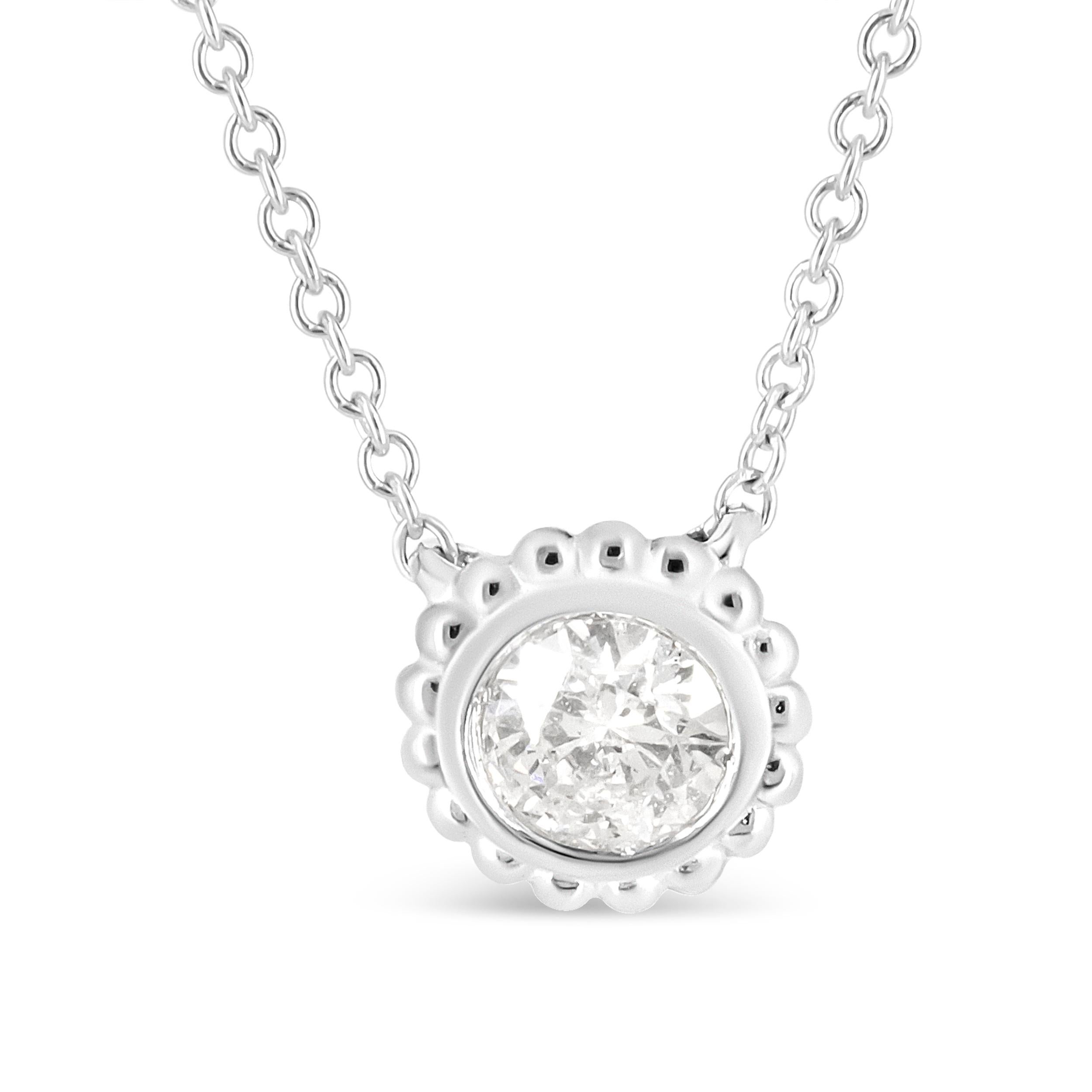 Count on this striking piece to stand out in a sea of diamond pendant necklaces. Unlike the typical design, the cable chain is cinched to one 1/2 cttw natural round diamond that’s fixed in a bezel setting and surrounded by 10K white gold details,