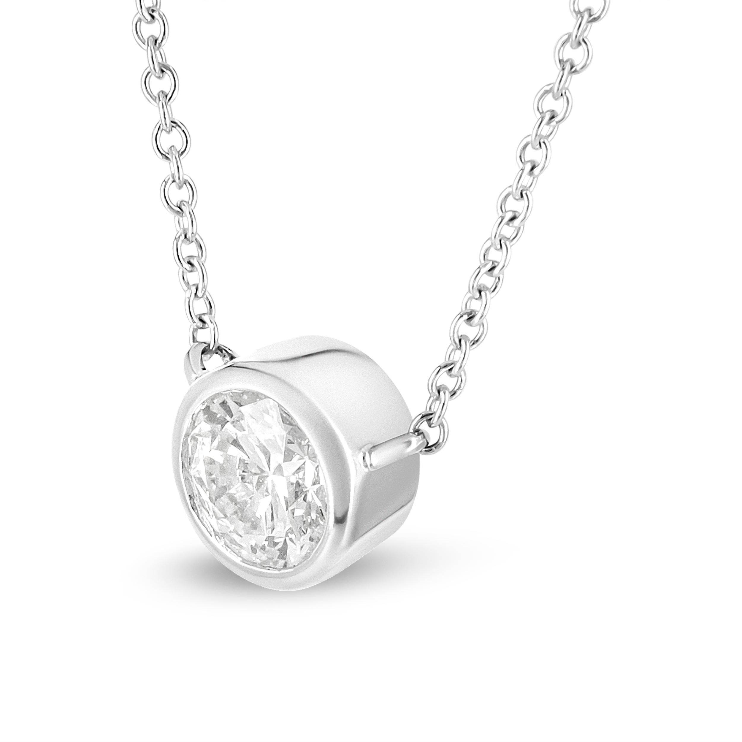 A secure bezel setting enhances the beauty of this 10k white gold solitaire diamond pendant necklace to give the appearance that it floats on the chain. This stunning round diamond is 1/3 cttw with an approximate I-J Color and I1-I2 Clarity. The