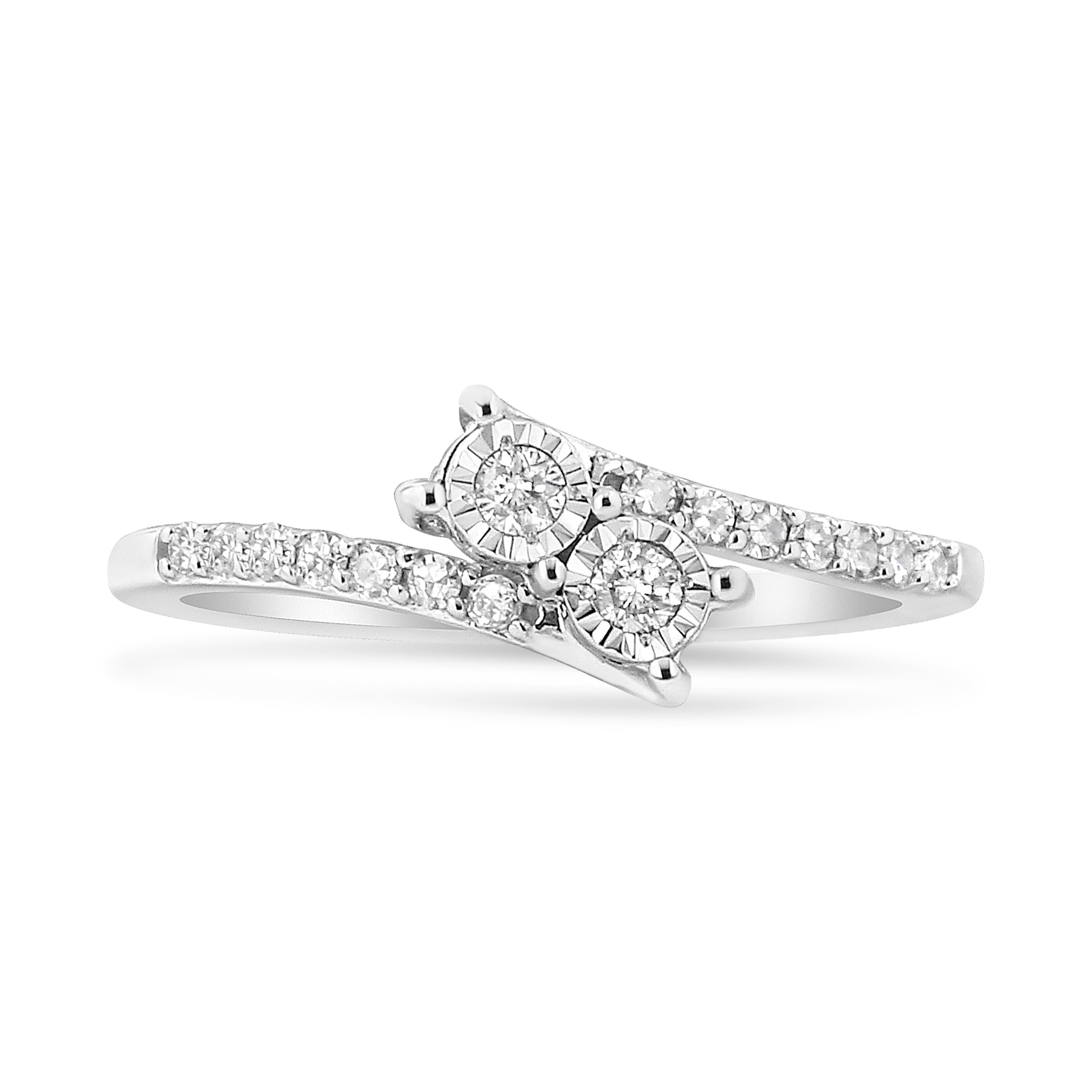 Make a remarkable addition to your diamond collection with this soul-striking diamond ring. Two round diamonds nestle inside curves of 10K white gold in this lovely two-stone ring for her. Fashioned in 10kt white gold, this diamond ring features a